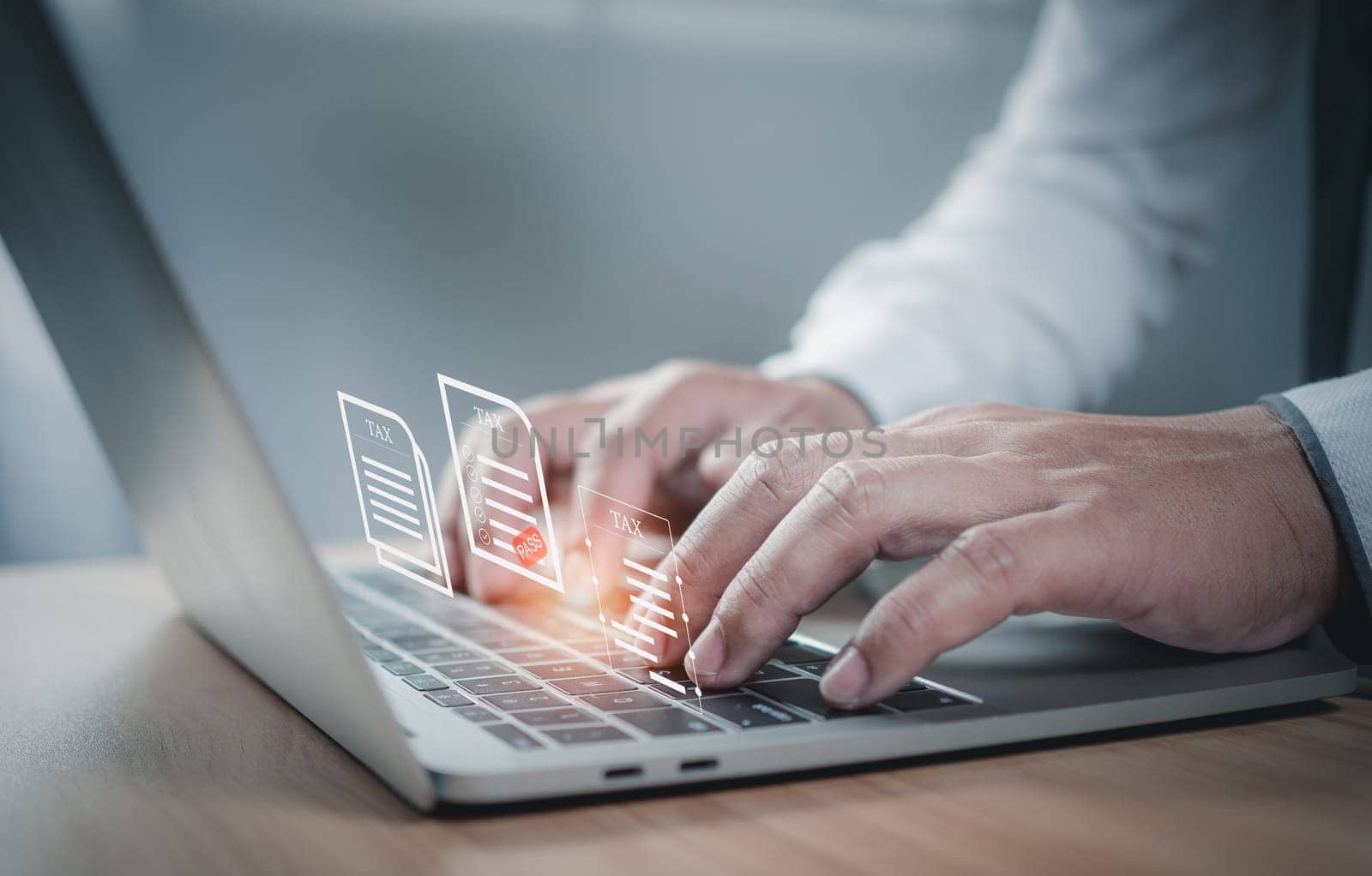 Businessman using a computer to complete Individual income tax return form online for tax payment. financial research, report. Calculation tax return.