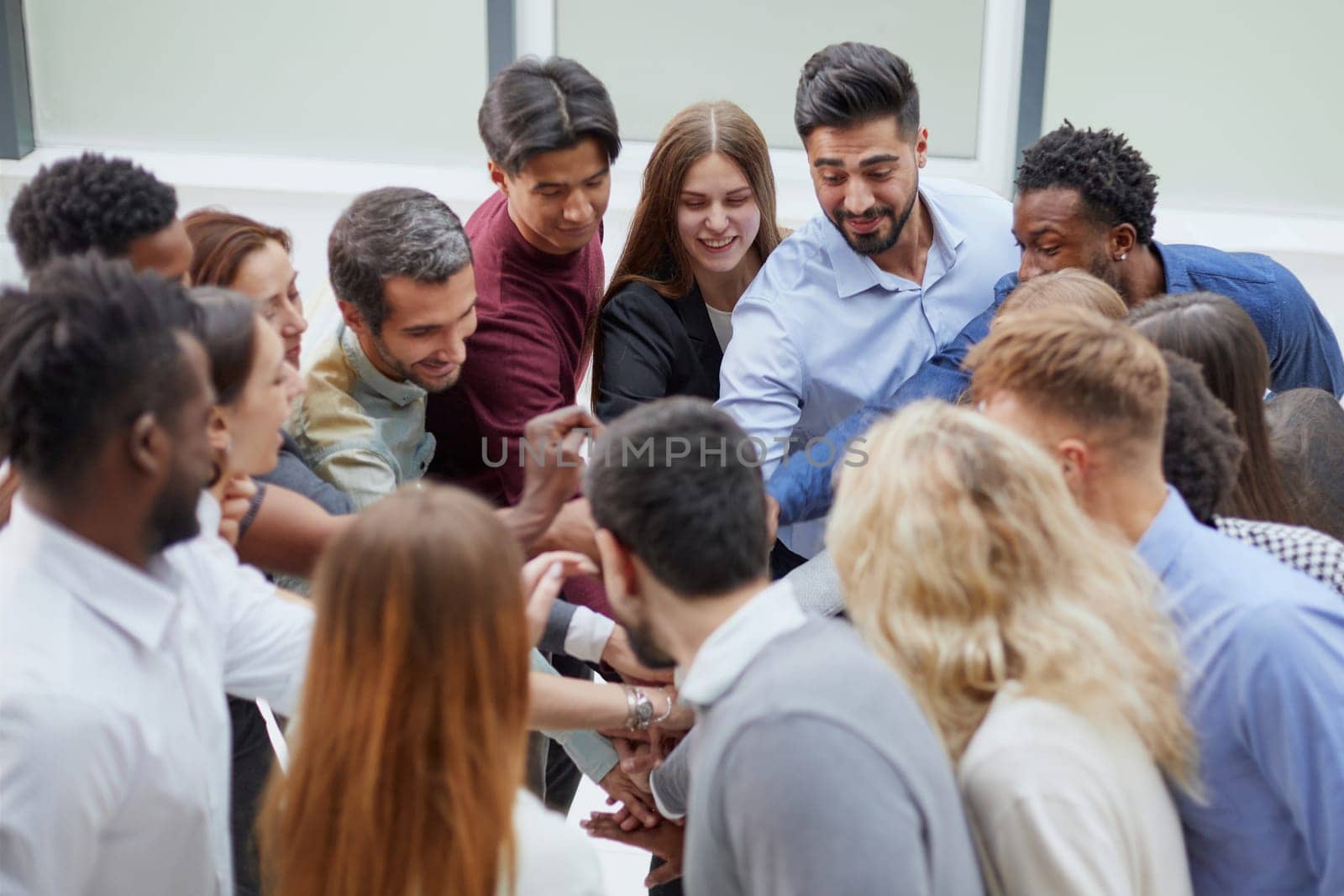 Rear view of friends standing in conference room