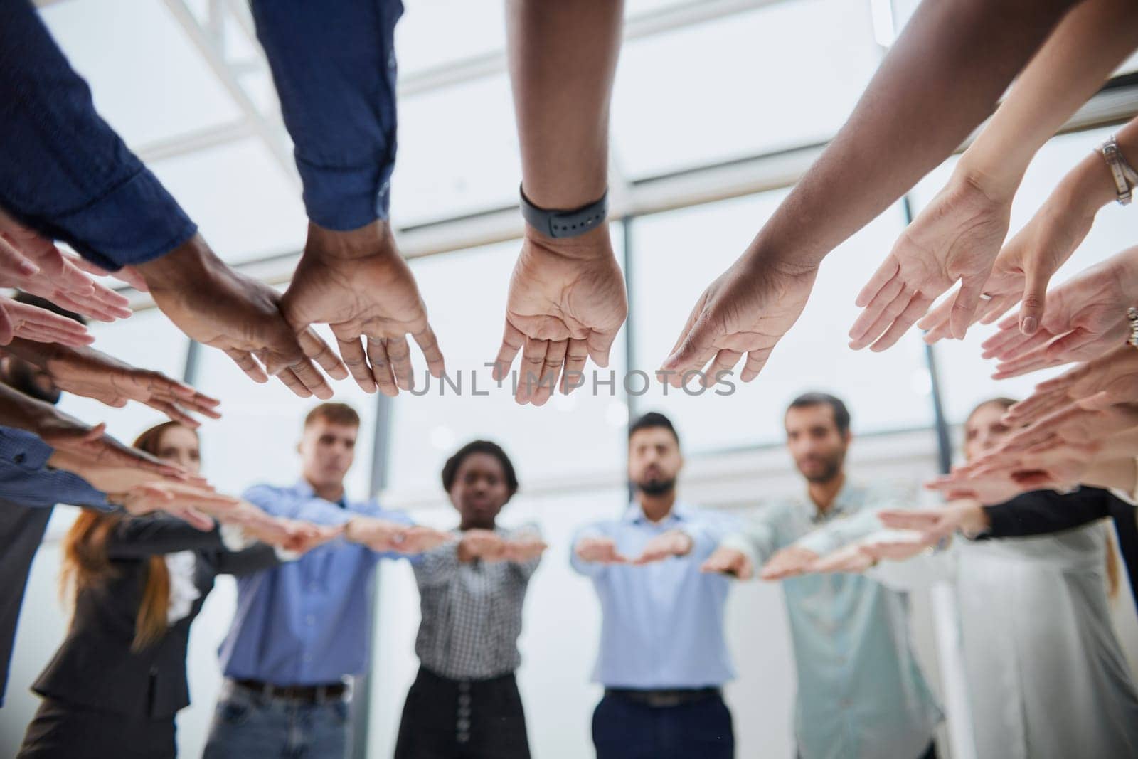 Friends exchanging the highfive in the office