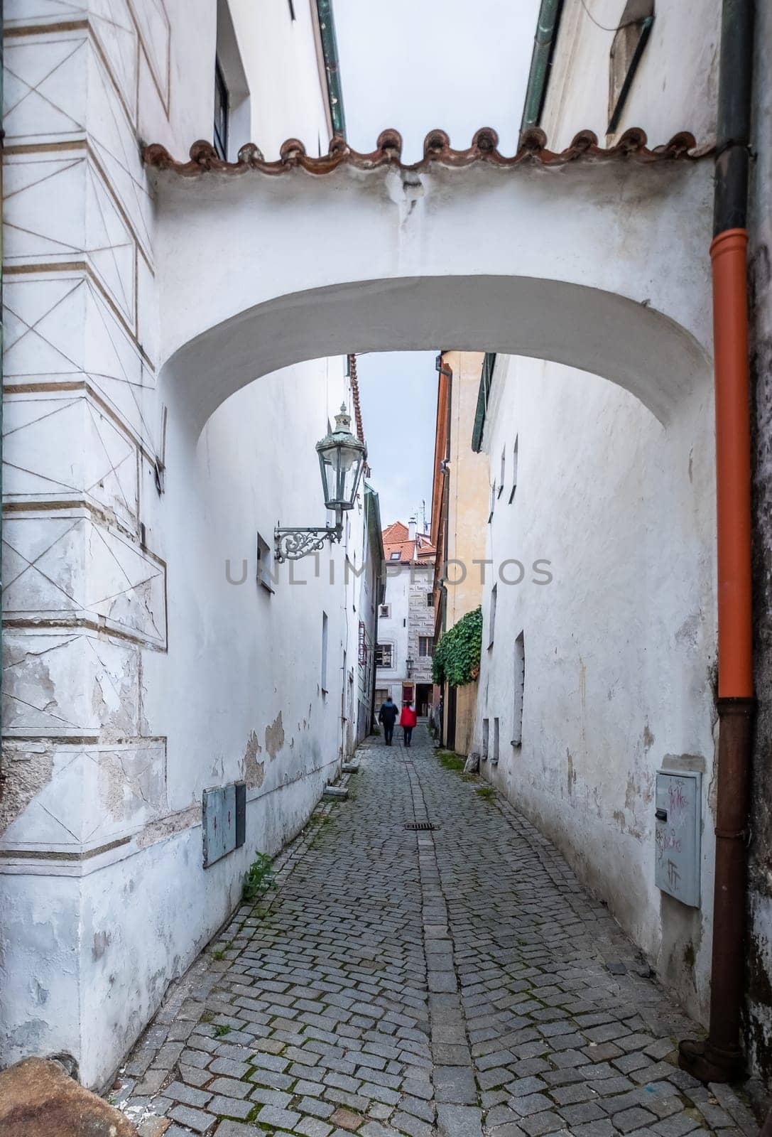 Ancient white arch over narrow street in Cesky Krumlov
