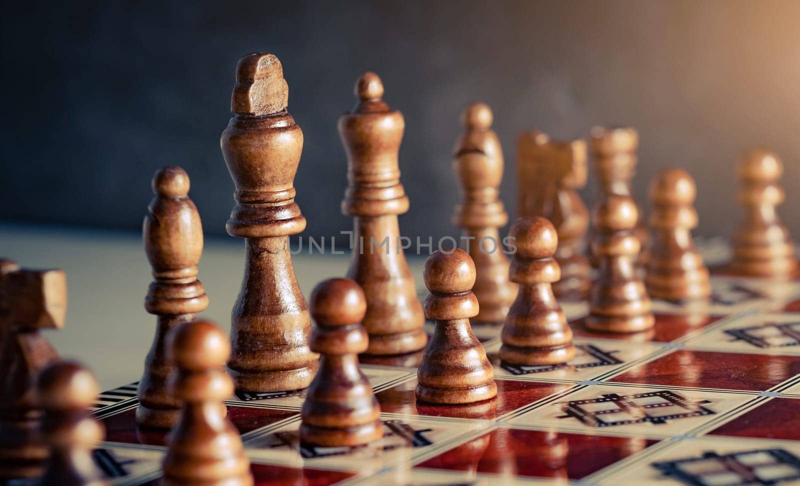 Closeup wooden figures on chess game board