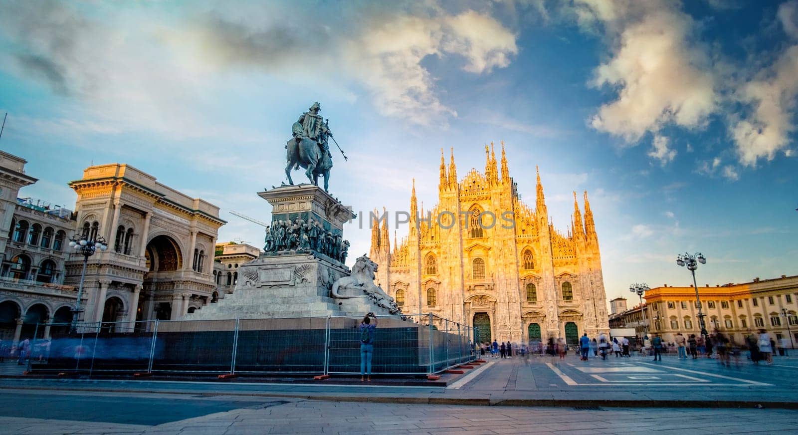 Famous piazza del Duomo in Milan at sunset