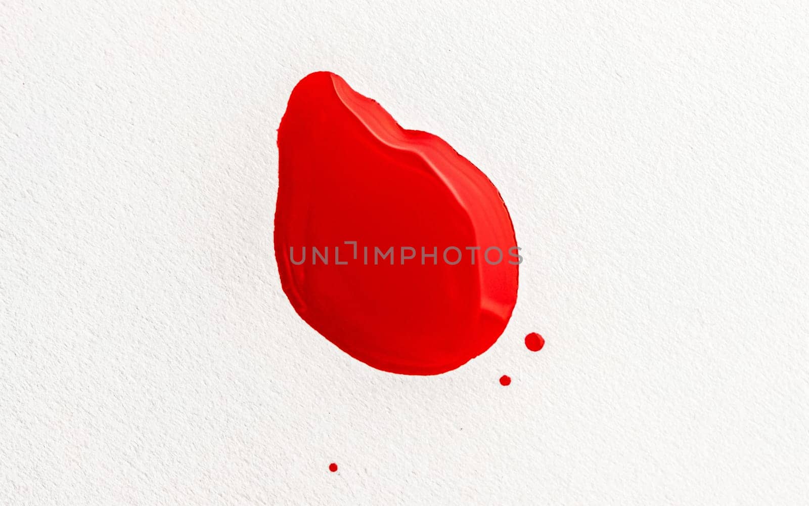 Stain of red paint on white background