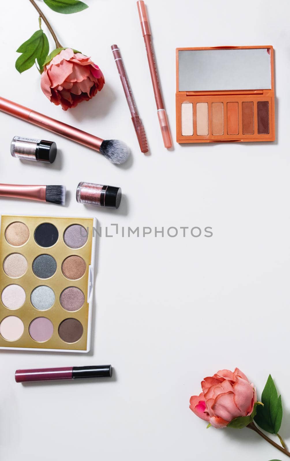Decorative flat lay composition with cosmetics and flowers. Flat lay, top view on white background by Mariakray