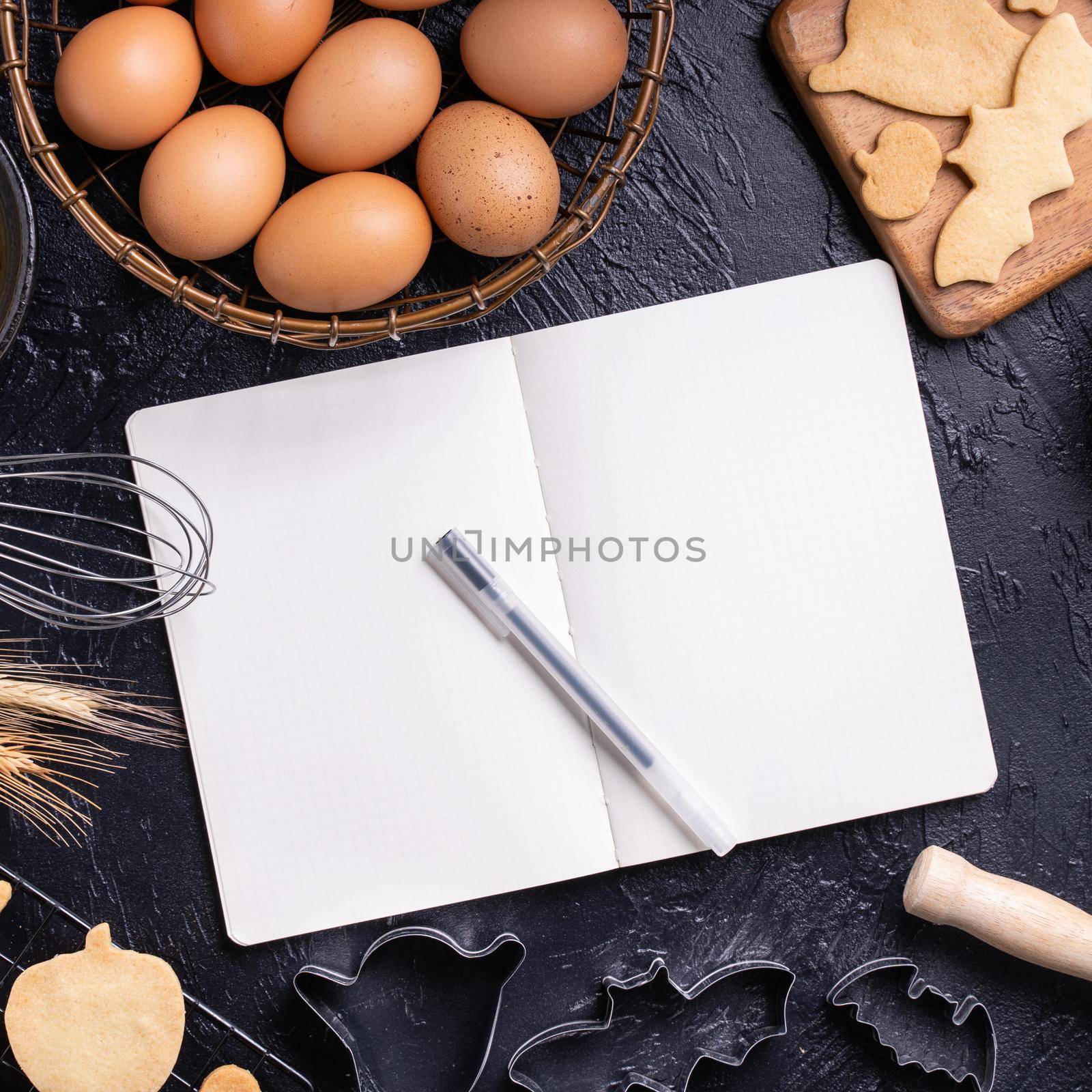 Making cookies cookbook recipe design concept, baking ingredients preparation layout with notebook, top view, flat lay, overhead, mockup copy space.