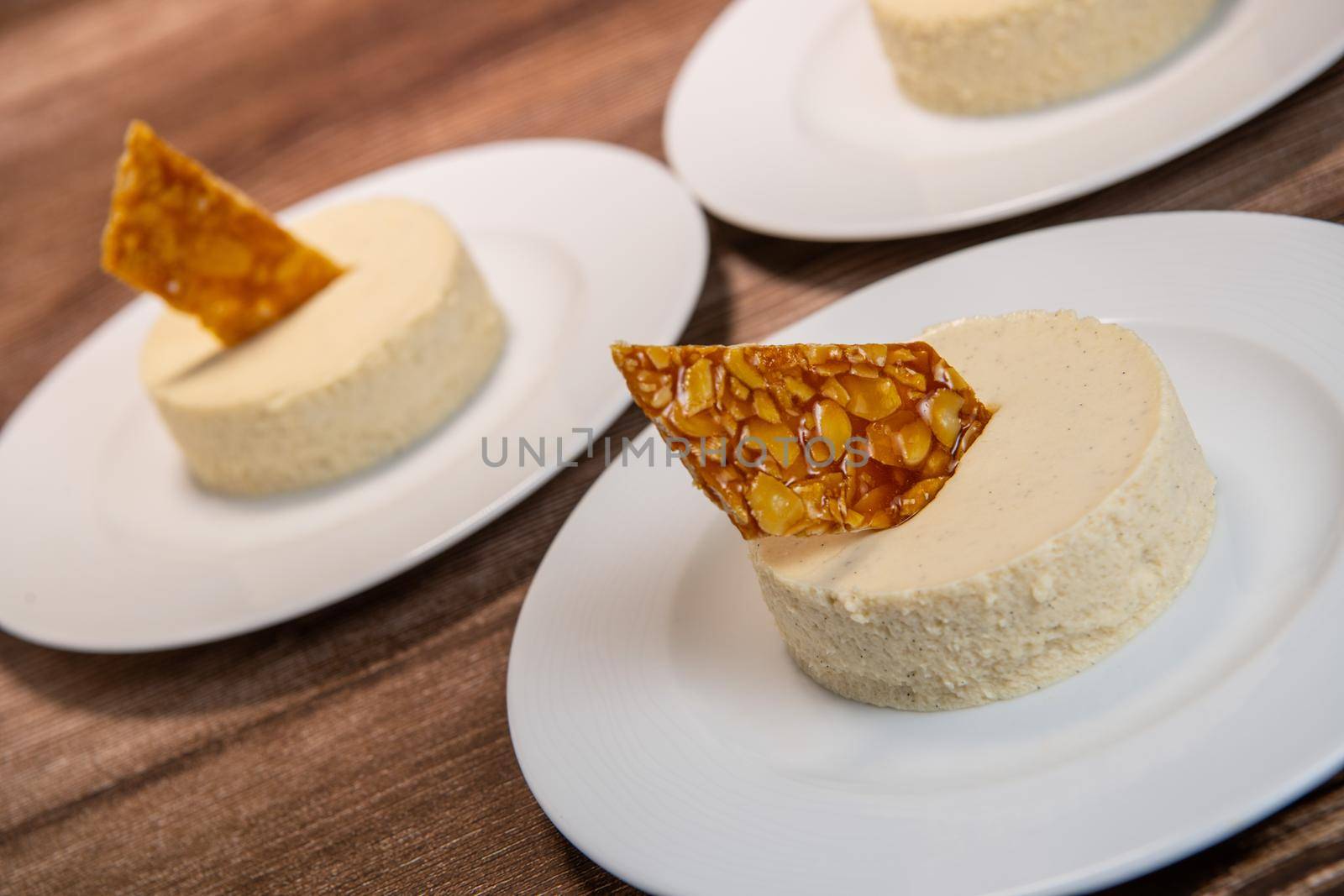 Bavarian recipe with pear and vanilla served with almond nougatine. High quality photo