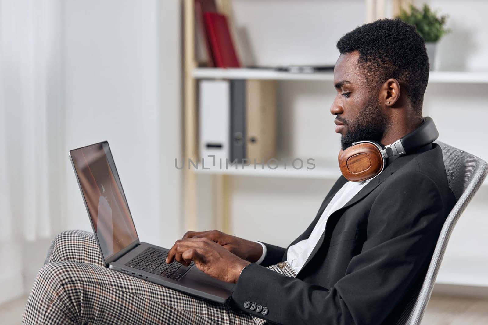 earphones man education laptop knowledge business class work office zoom translate video call indoor conference computer course american headphone black job student learn african