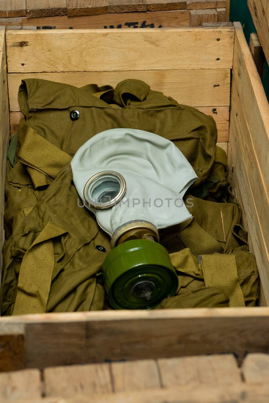 Soviet gas mask in a wooden box. Warehouse of Soviet protective equipment.