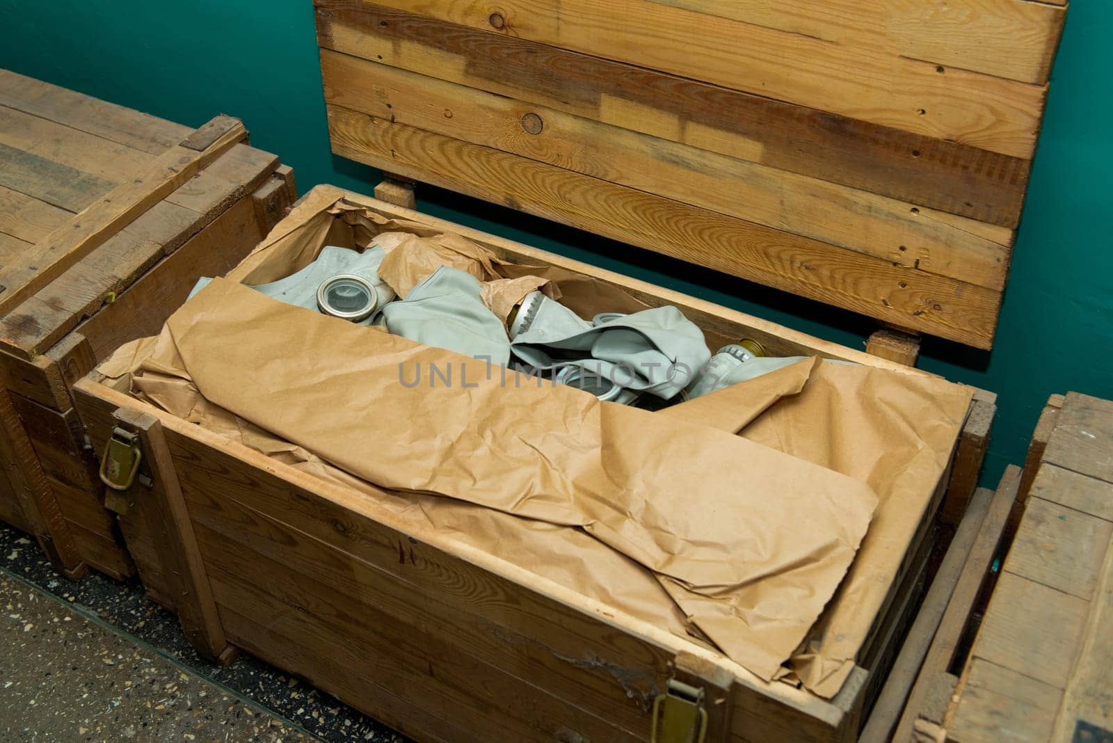 Soviet gas mask in a wooden box. Warehouse of Soviet protective equipment.