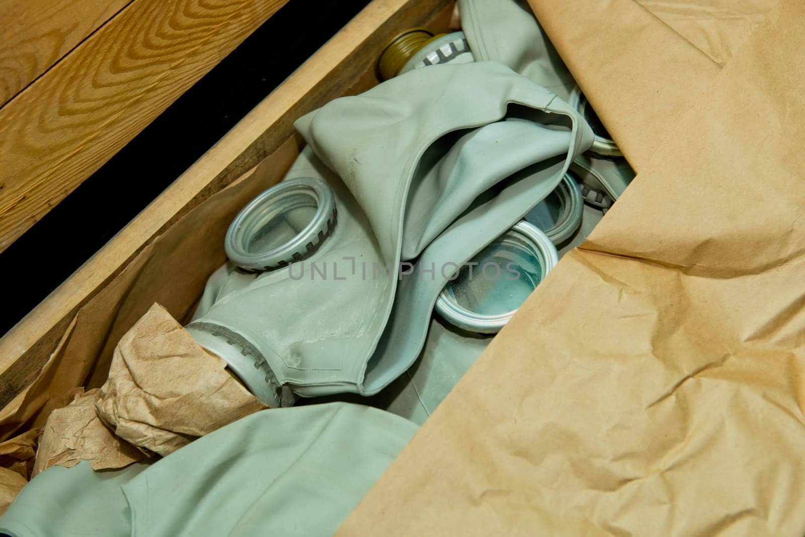 Soviet gas mask in a wooden box. Warehouse of Soviet protective equipment. Close-up.