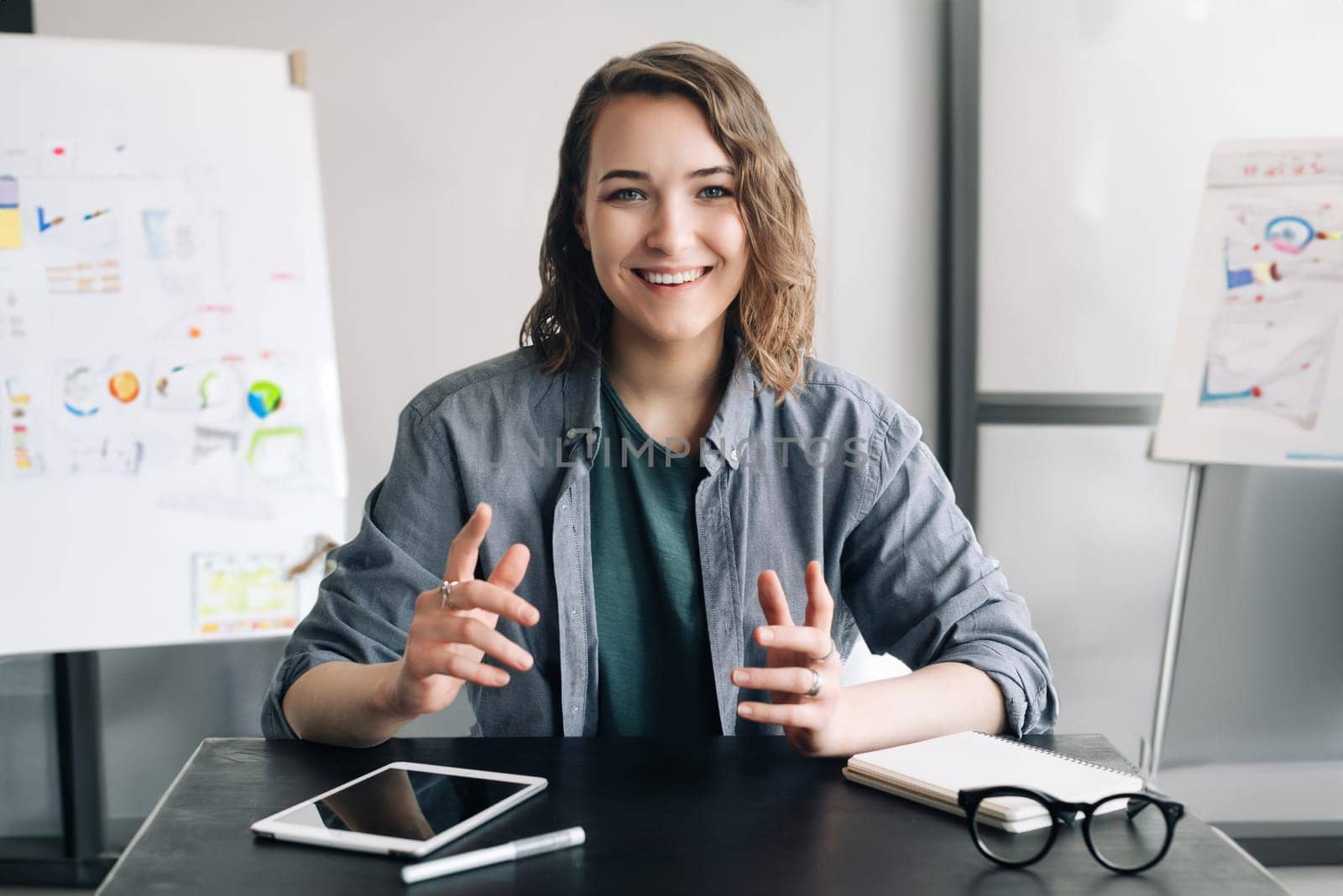 Professional and Engaging: Beautiful Business Woman Conducting a Video Conference, Communicating and Connecting with Confidence Through Web Camera, Whether in the Office or from the Comfort of Home. by ViShark