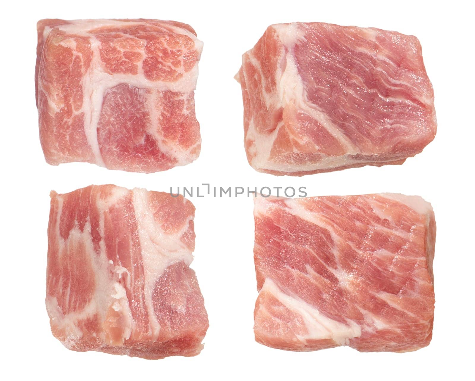 Raw pork cubes. Cubes of pieces of pork scatter in different directions, isolated on a white background. Isolate cubes of juicy pork for inserting into a design or project. by SERSOL