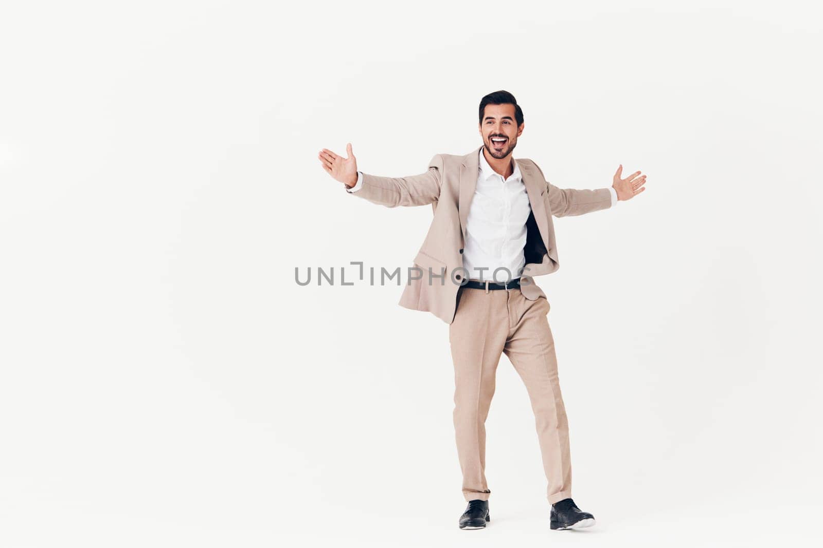 man background suit businessman beige smiling success portrait stylish business sexy smile running happy flying studio victory attractive work winner standing