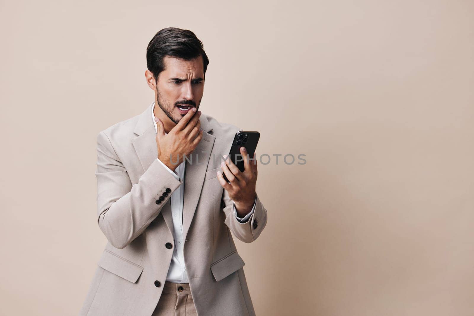 isolated man male handsome portrait online trading smile hold background lifestyle phone happy cellphone call suit entrepreneur business selfies message smartphone