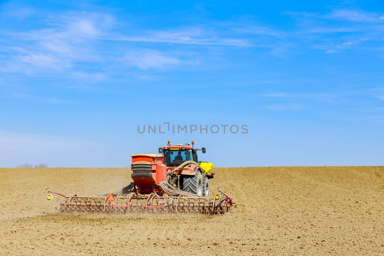 Tractor driver carefully maneuvered through field, ensuring accurate seed placement. Agricultural machinery, including tractors, has revolutionized way farmers sow grains.