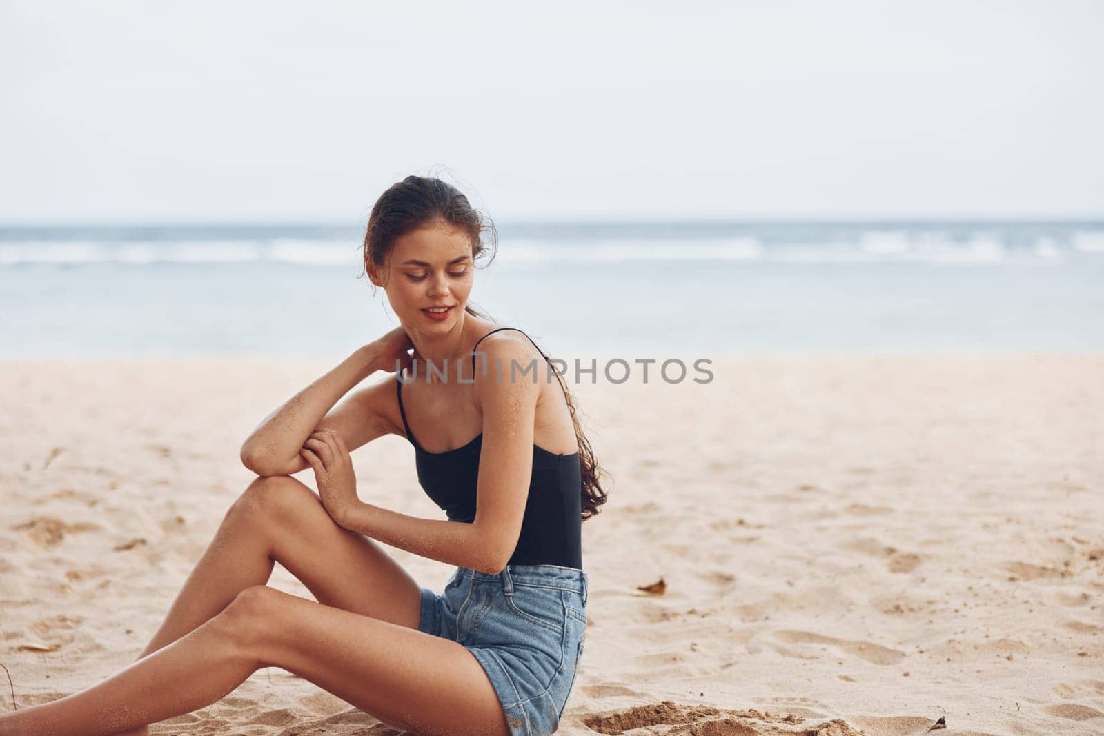 woman tan smile sexy lifestyle model sitting body back nature person view outdoor sand travel caucasian freedom beach fashion sea ocean vacation