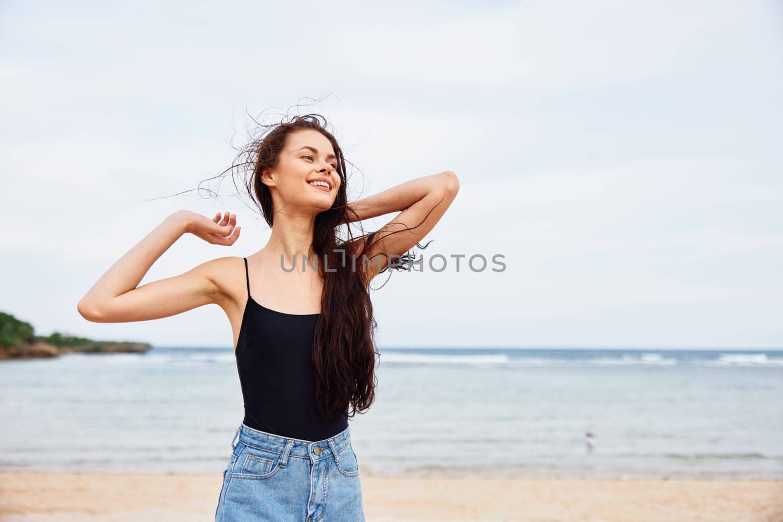 woman sand walking travel vacation young carefree happiness beautiful free copy summer nature space sunset water ocean coast smile sea person beach