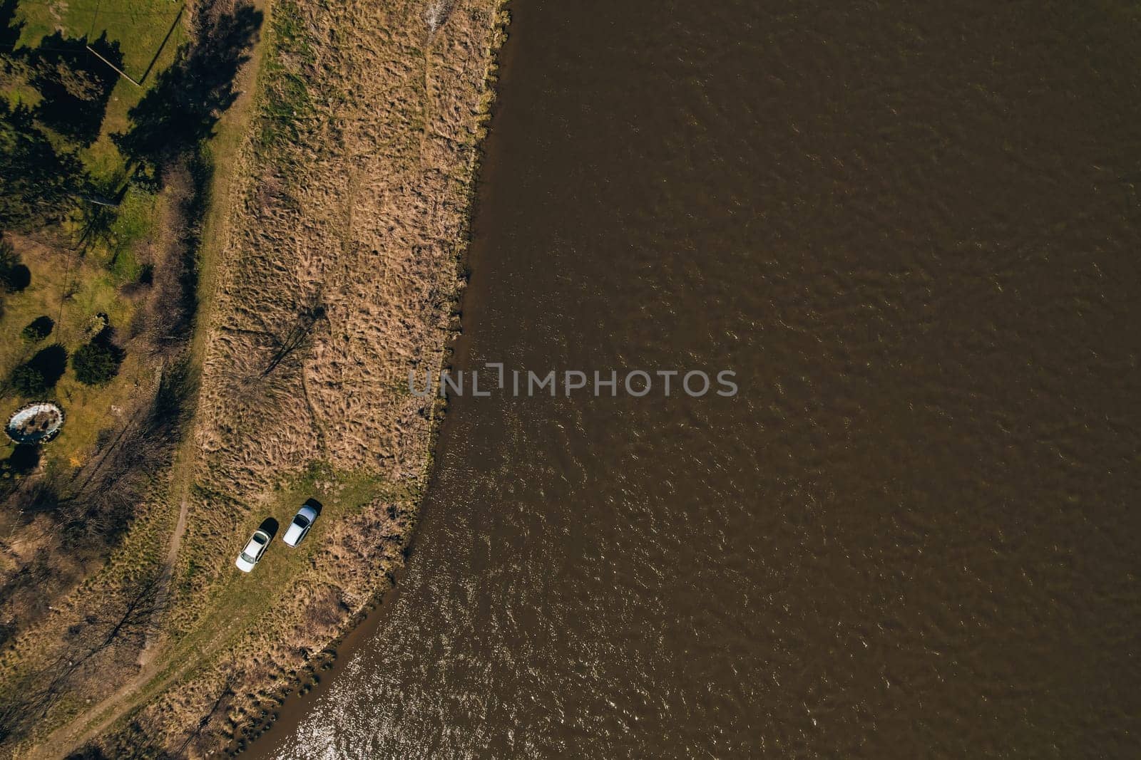 Aerial view drone of two cars on bank river. Concept of Outdoor activity spending time in unity with nature. Getting away. Local travel
