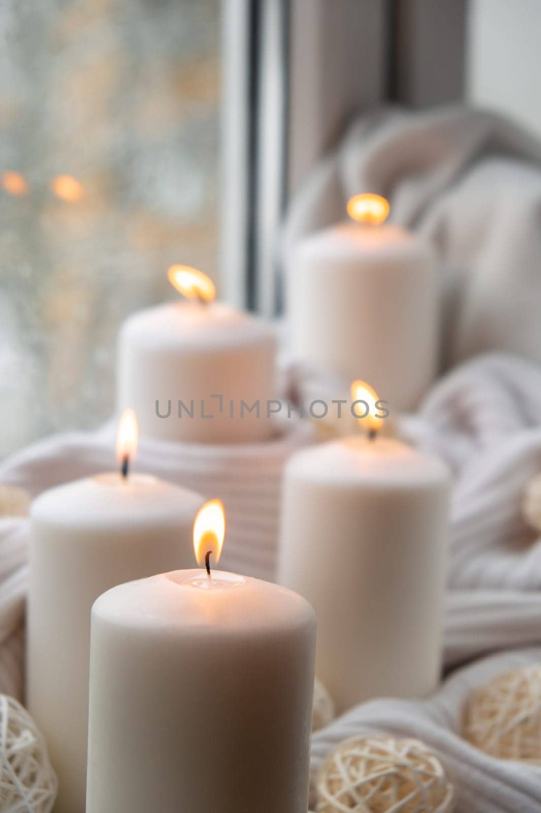 Home fragnance concept autumn holidays at cozy home on the windowsill Hygge aesthetic atmosphere on knitted white sweater. Still life of micro moment candid slow living. Mental health wellbeing exercises Raining Outside