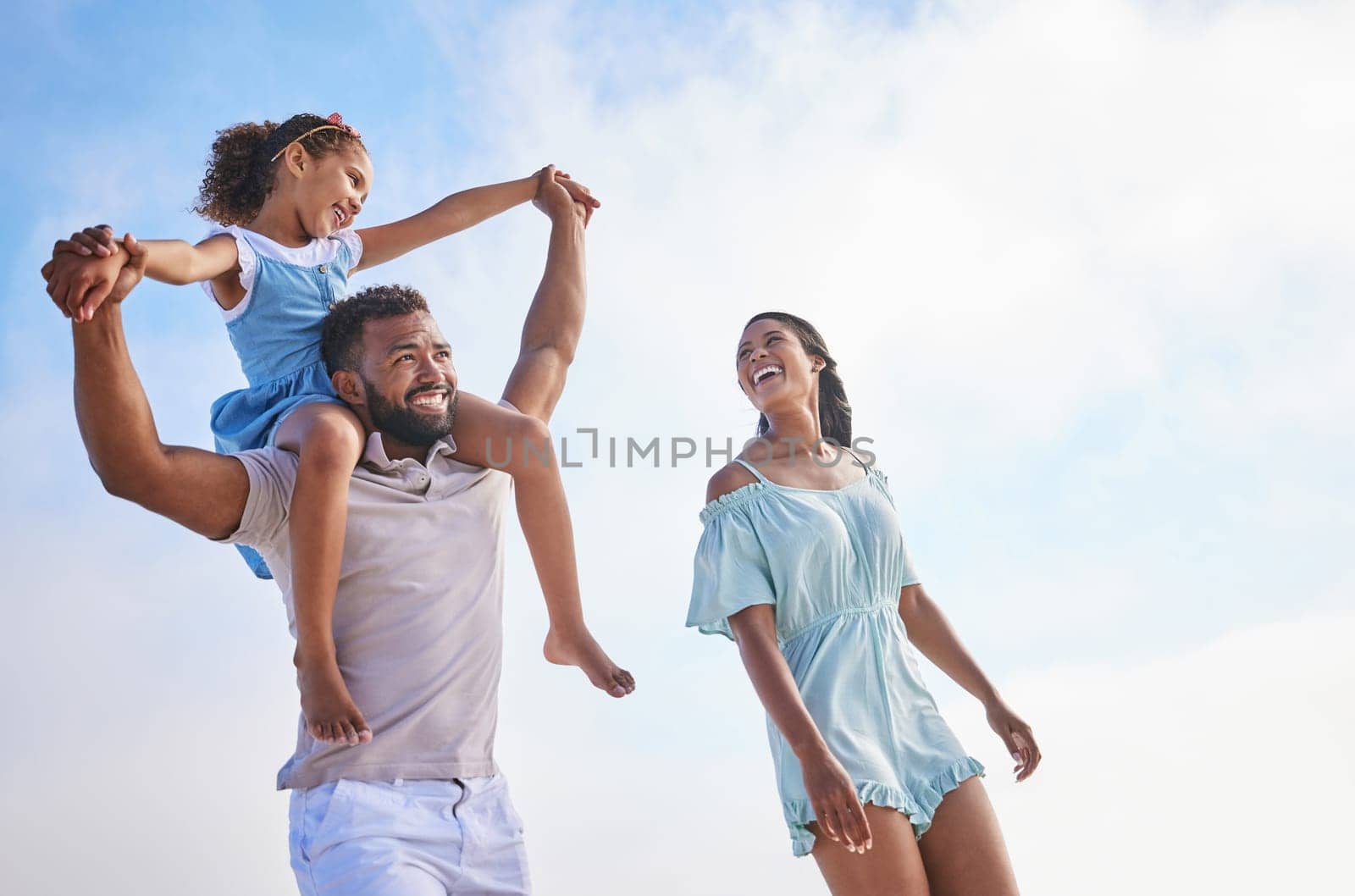 Piggyback, sea or parents walking with a child for a holiday vacation together with happiness in summer. Holding hands, mother and father playing or enjoying family time with a happy girl or kid.