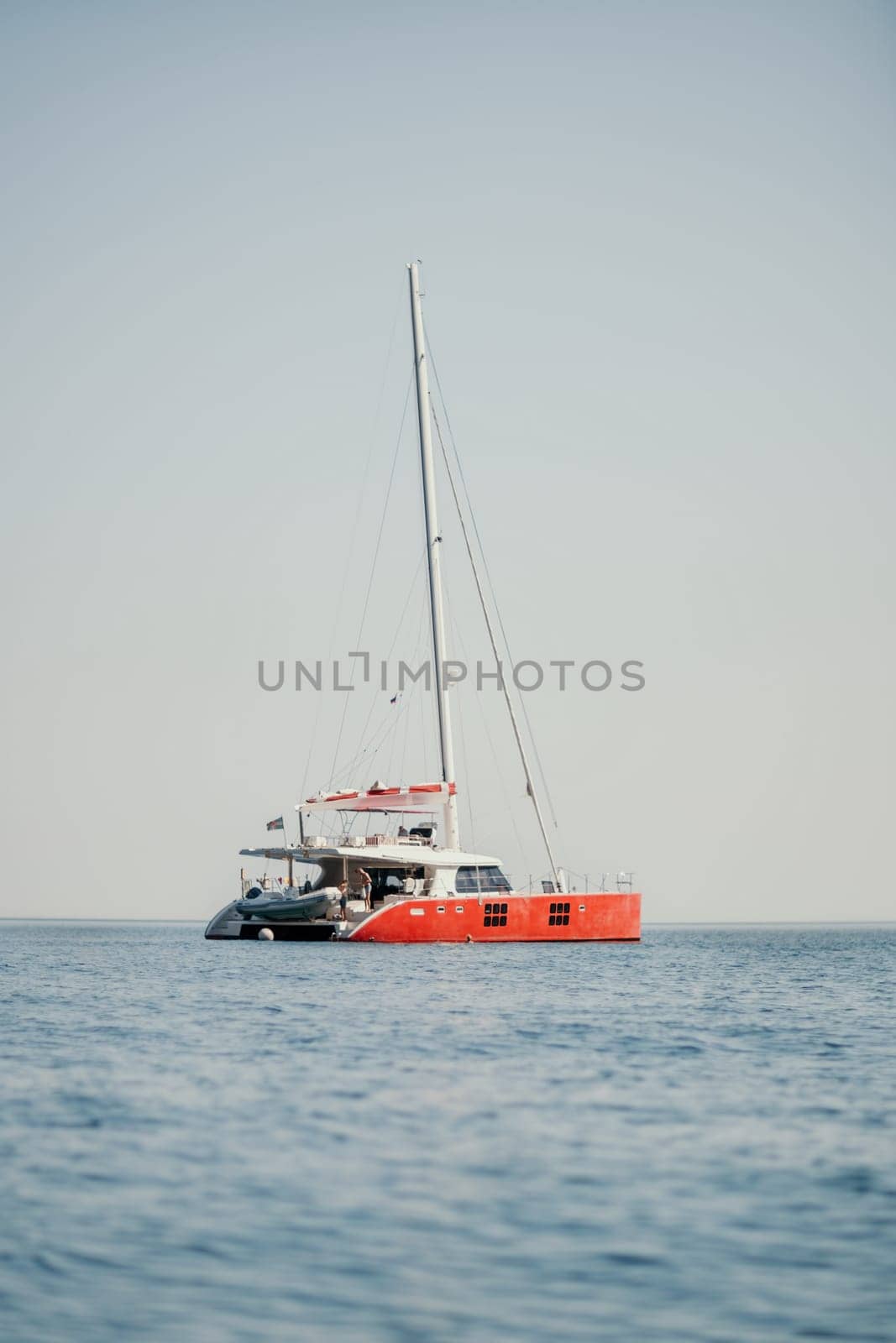 Aerial boat race. Luxury cruise trip. View from above of white boat on deep blue water. Aerial view of rich yacht sailing sea. Motor boat racing wave. Summer journey on luxury ship