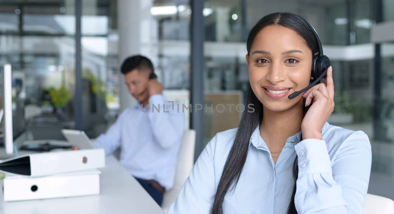 Woman in portrait, smile and call center with CRM, contact us and communication with headset at office. Happy female consultant in customer service, telemarketing or tech support with help desk job by YuriArcurs