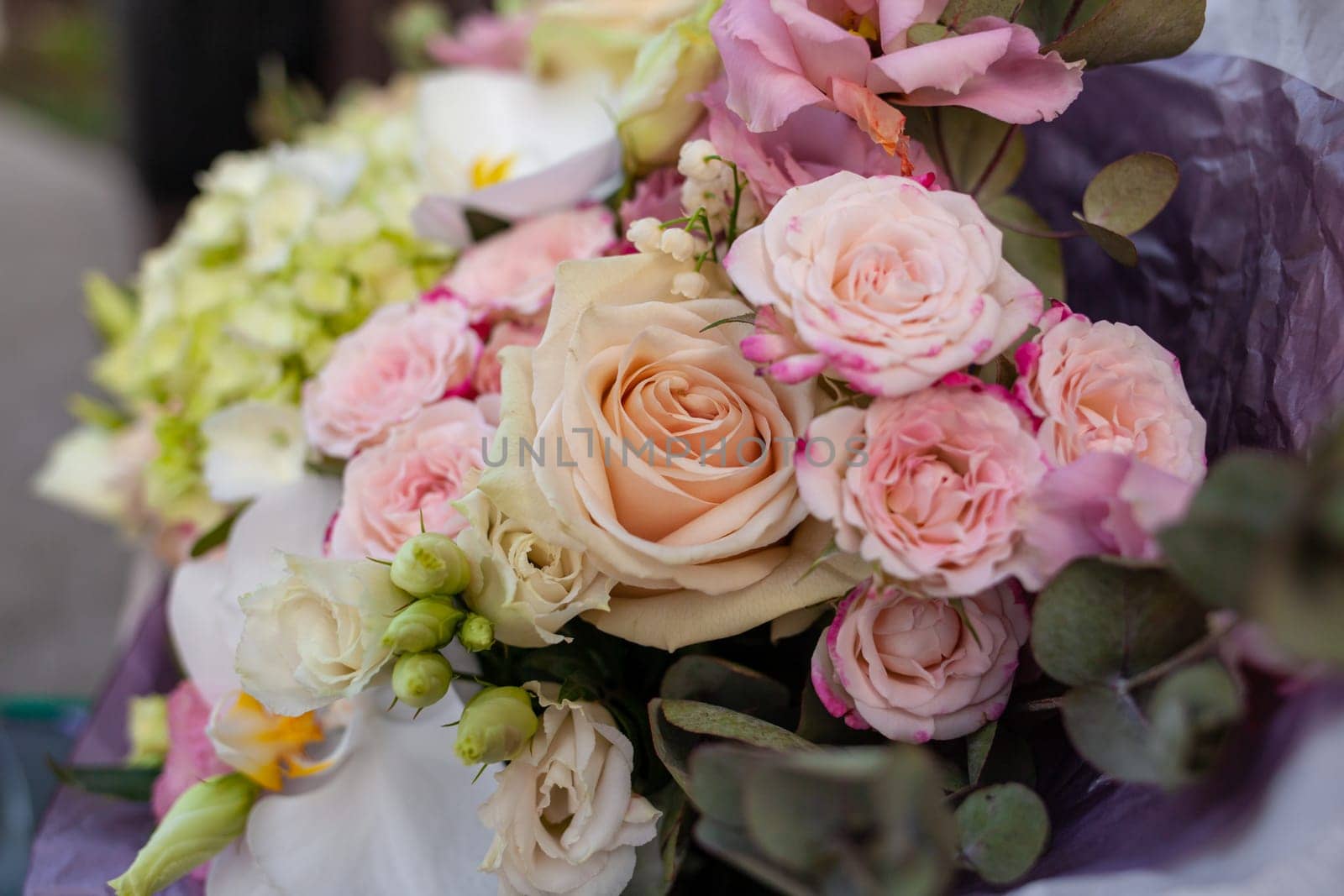 Wedding bouquet close-up. Flower gift for a person. Composition of flowers in a bouquet.