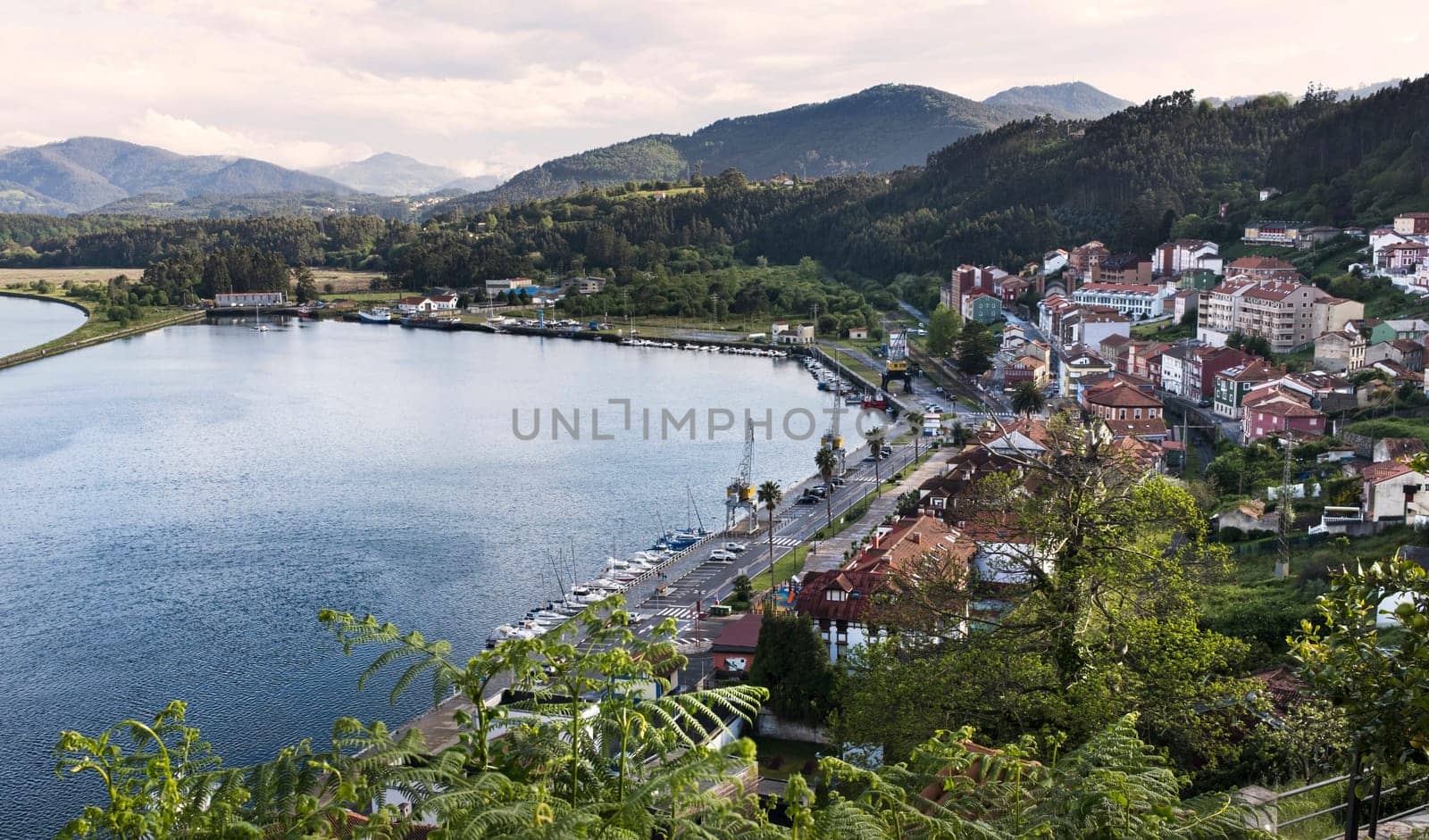 Aerial view of the bay and town of San Esteban de Pravia in Asturias at sunset and in spring.