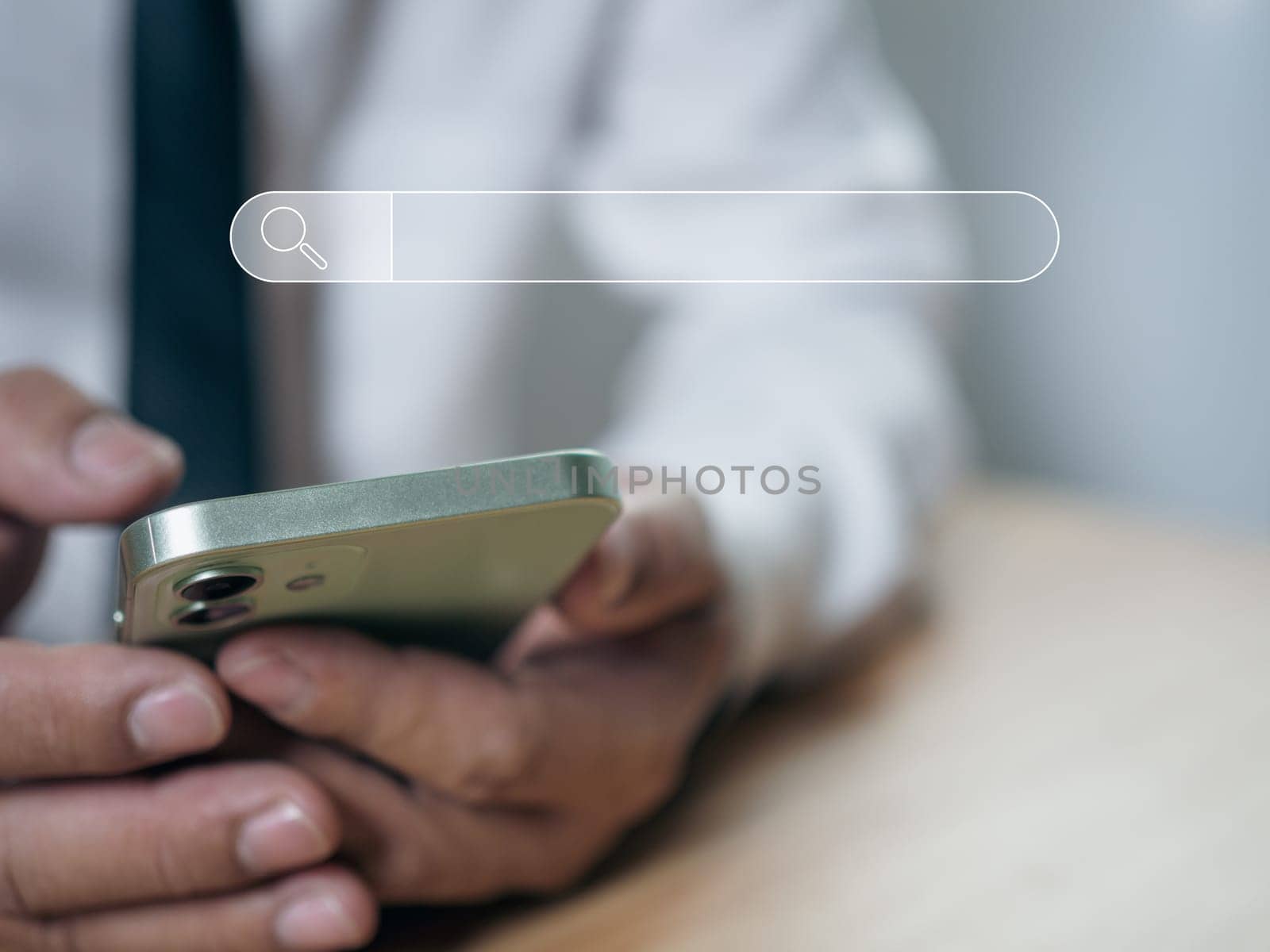 The concept of searching for information from the phone's network. A phone placed on the lid of the business people hand. by Unimages2527