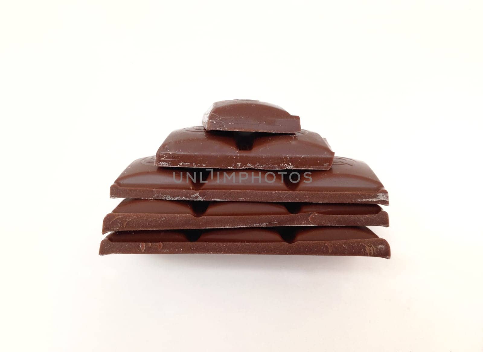 Dark chocolate bar texture isolated on white background from back view. Milk chocolate photo