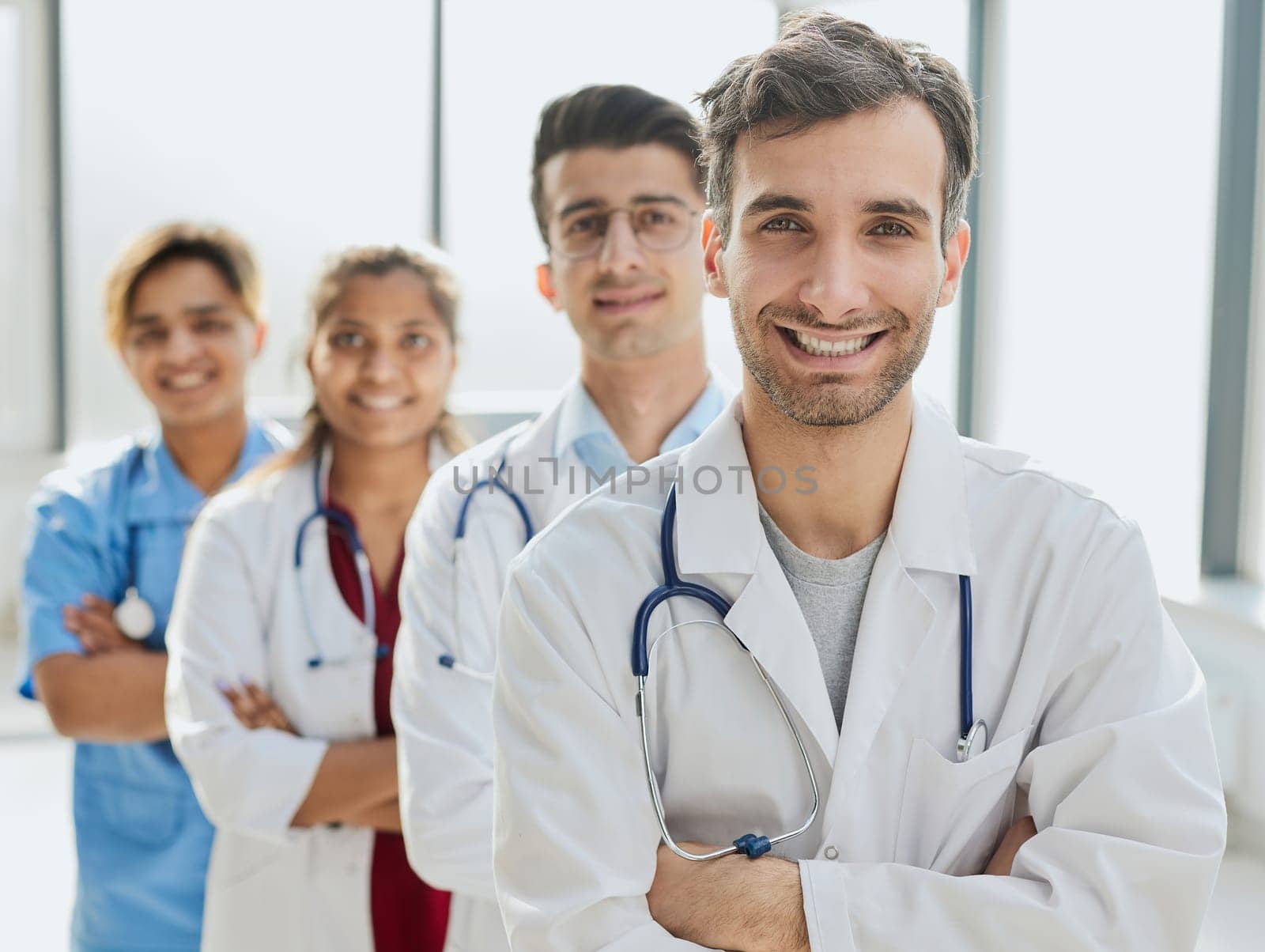 portrait of a multiethnic group of doctors standing in a row by Prosto