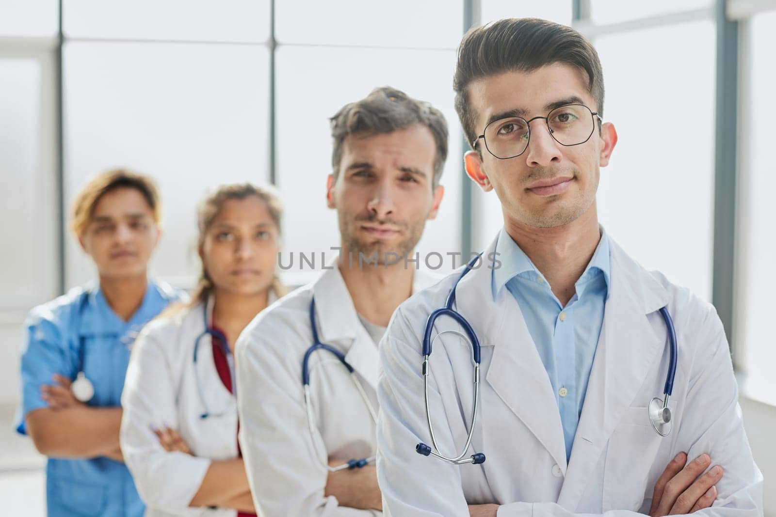 portrait of a multiethnic group of doctors standing in a row