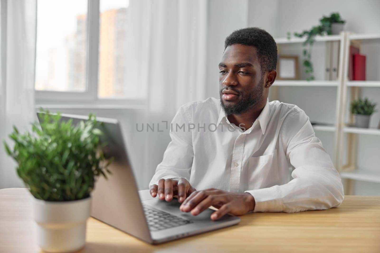 cyberspace man computer american laptop online career manager businessman office workplace chat table smiling black person education freelancer american student african job