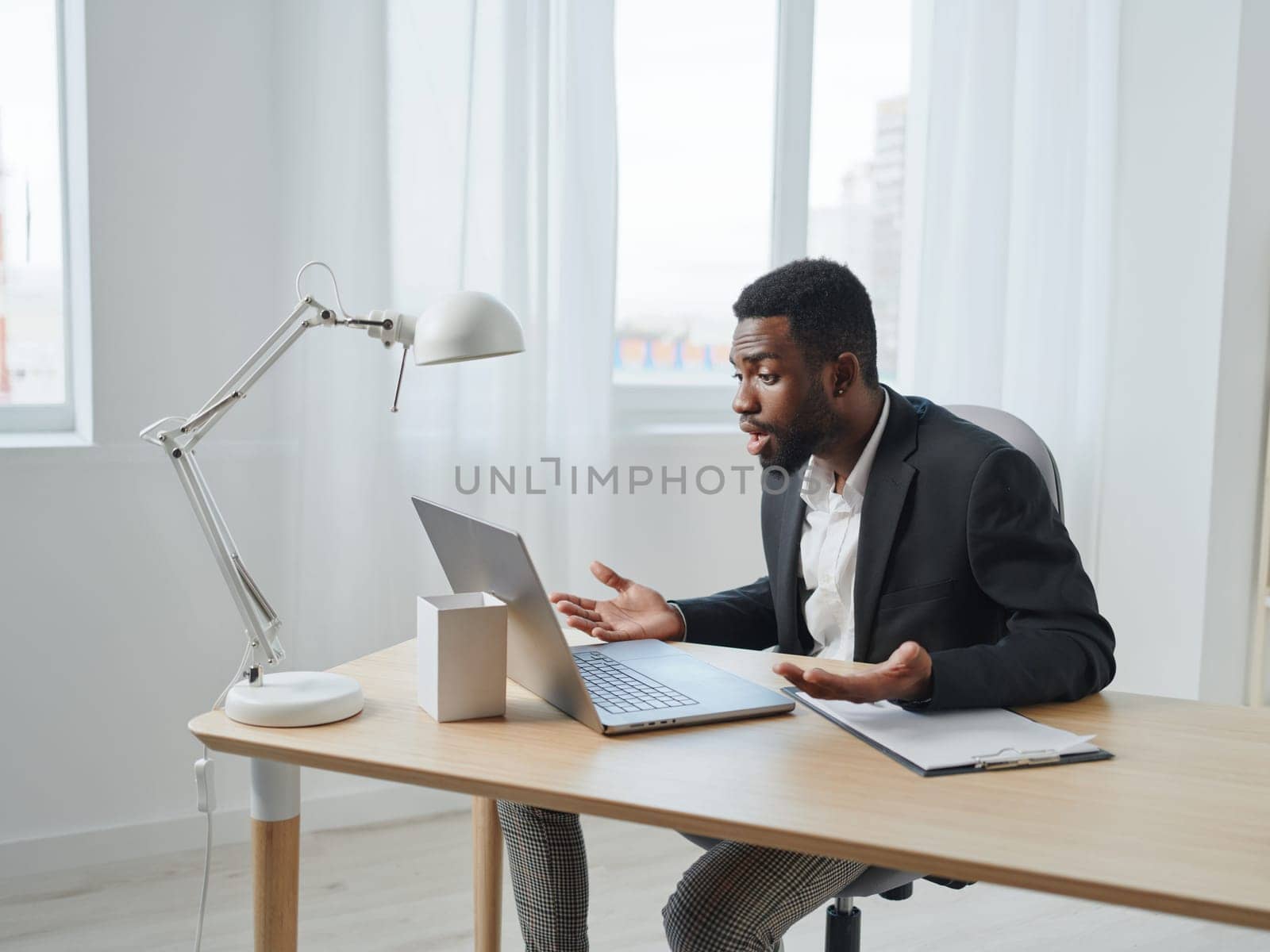 man job freelancer laptop student cyberspace computer office online education african american by SHOTPRIME