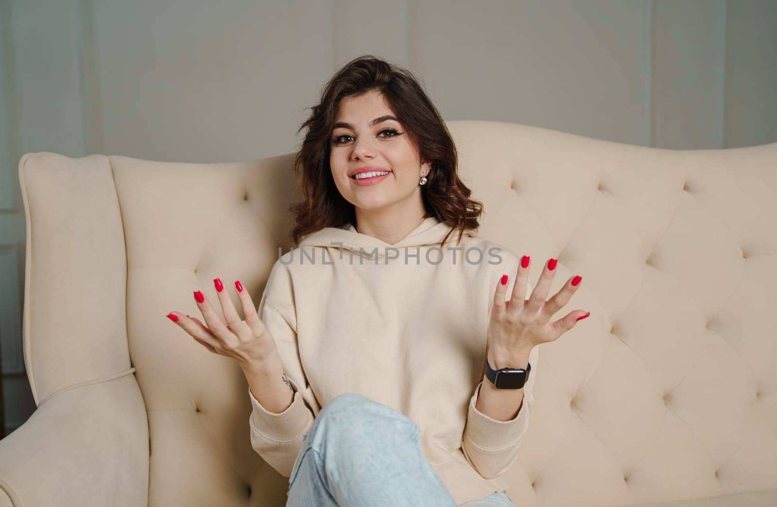 Smiling young woman blogger vlogger influencer working at home. Girl speaking looking at camera talking making videochat or conference call, Female record blog vlog. High quality photo