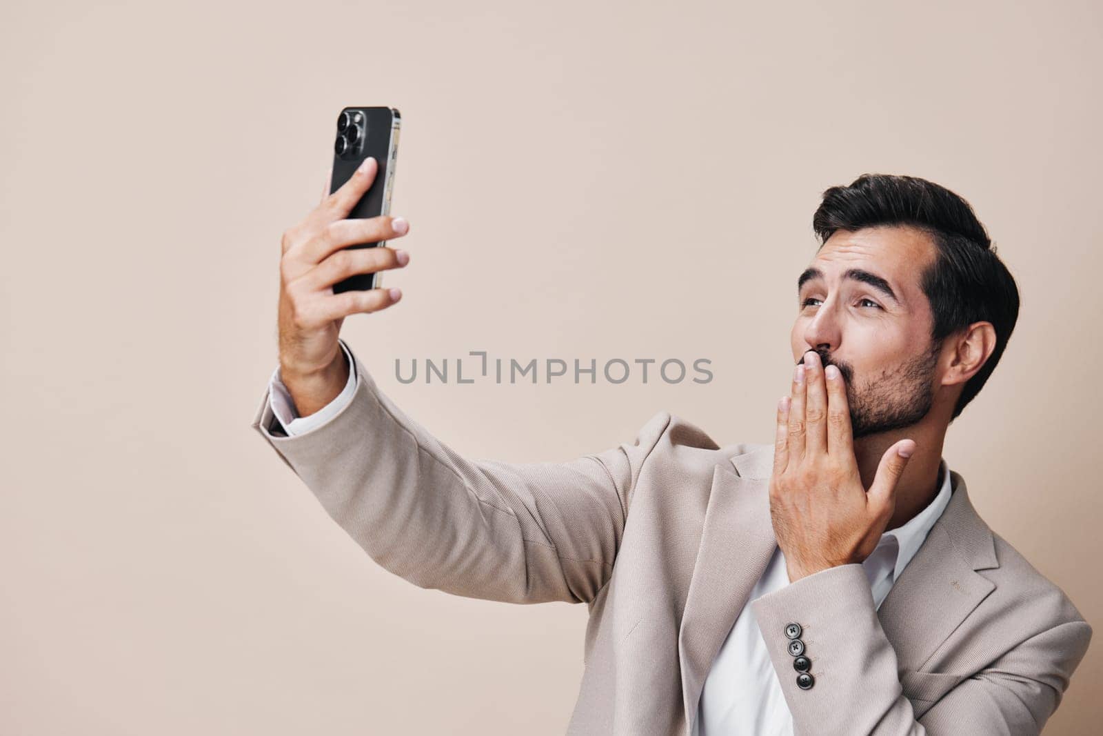 hold man happy smartphone phone portrait smile connection call suit business by SHOTPRIME