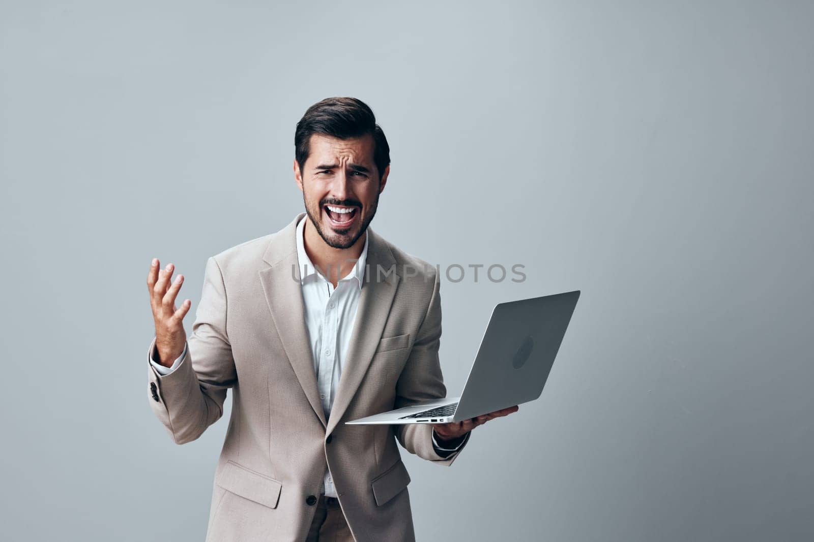 freelancer man smiling stylish computer person internet young handsome digital job smile shirt suit laptop online manager white copyspace business beige