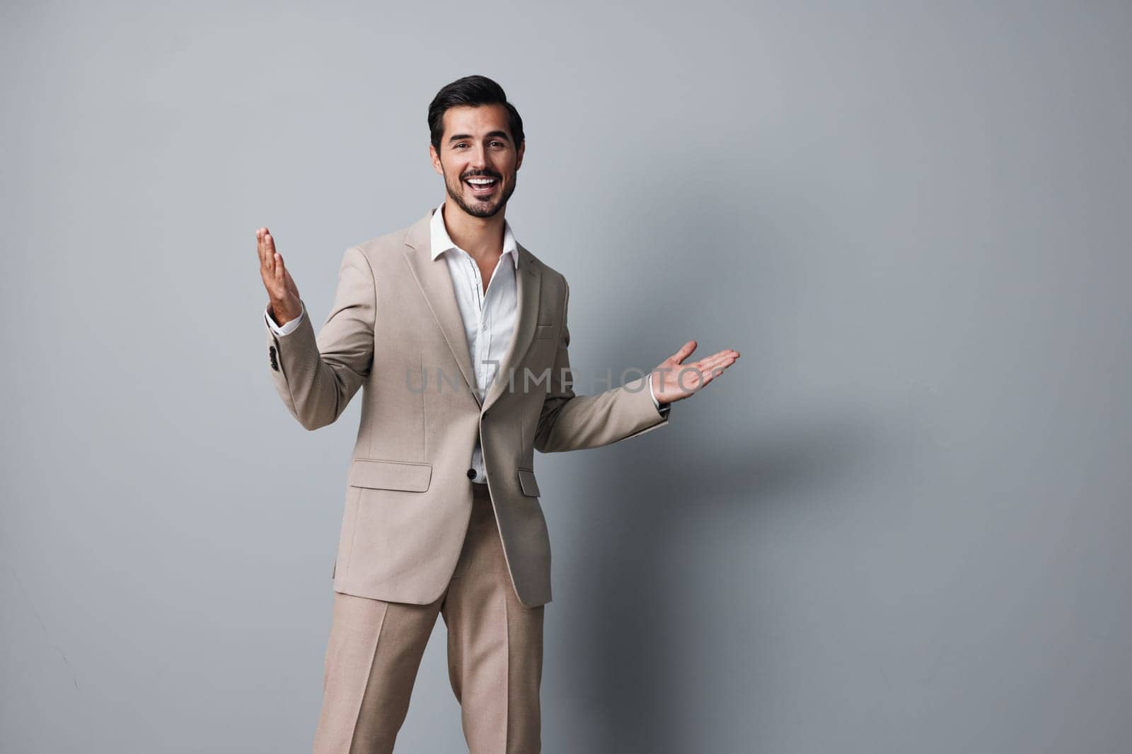 man happy office businessman beige handsome suit business copyspace smiling portrait by SHOTPRIME