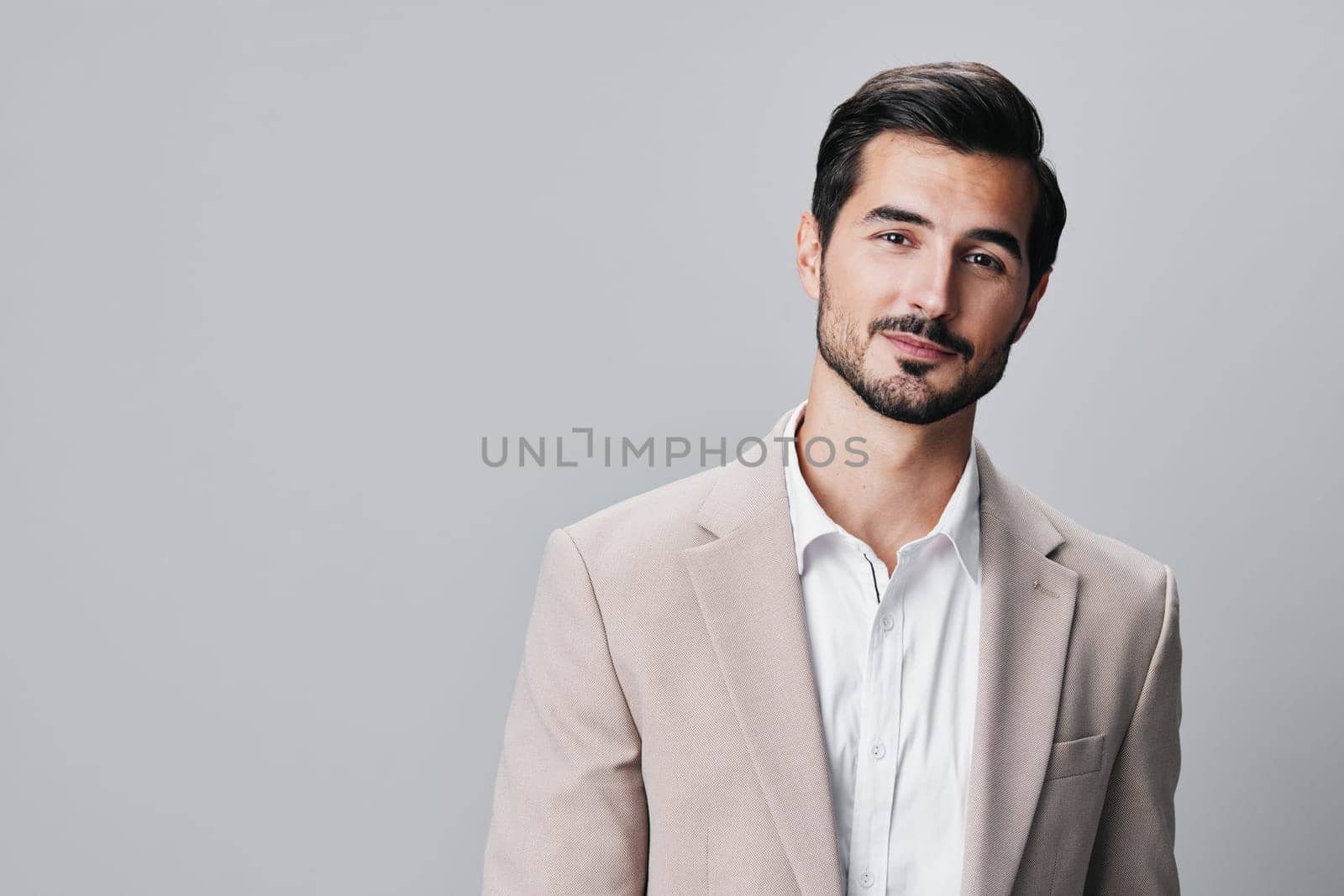 man office smiling happy copyspace suit corporate business confident stylish professional handsome successful posing isolated male businessman executive portrait beige eyeglass