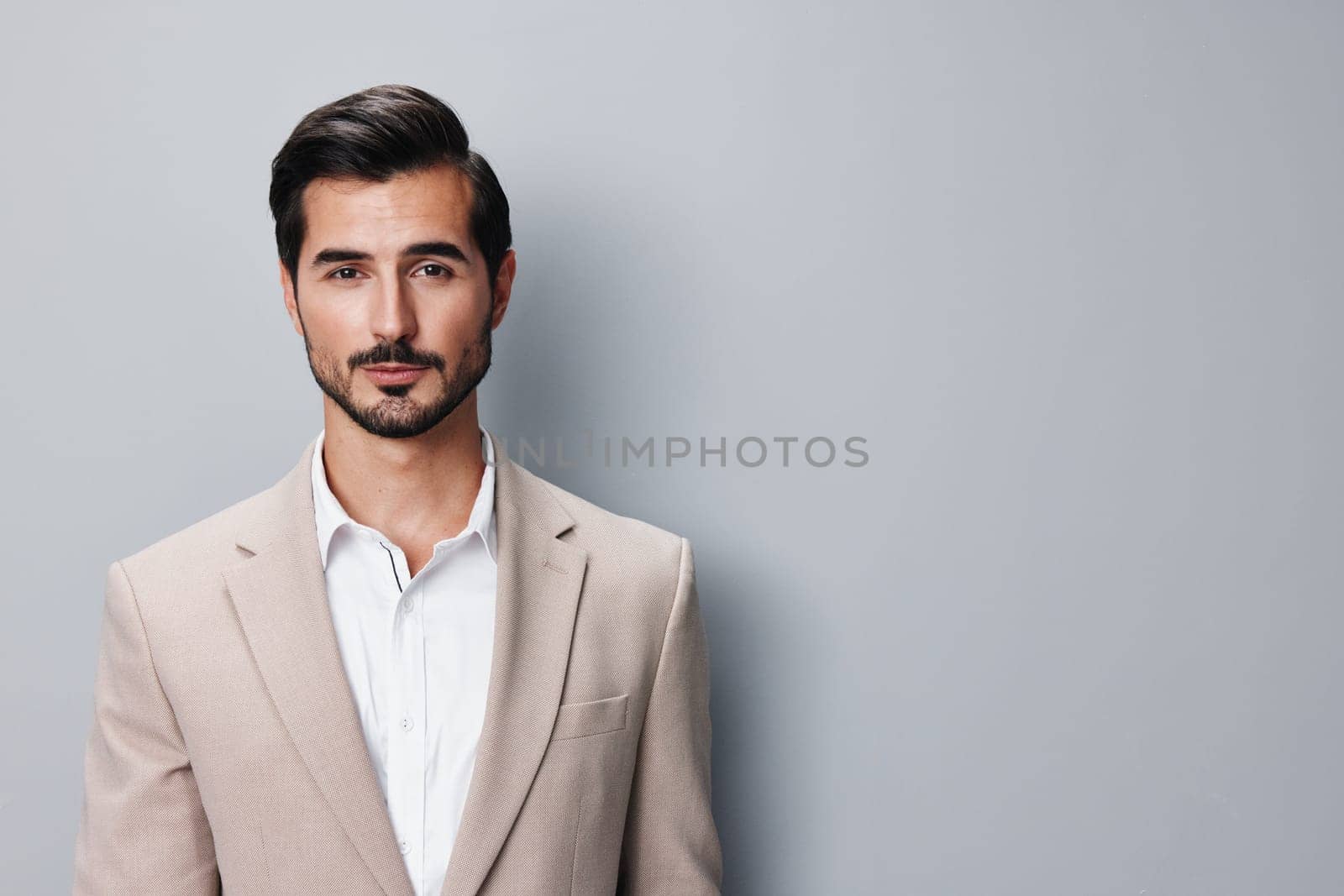 man beige suit handsome copyspace happy stylish smiling business portrait businessman by SHOTPRIME