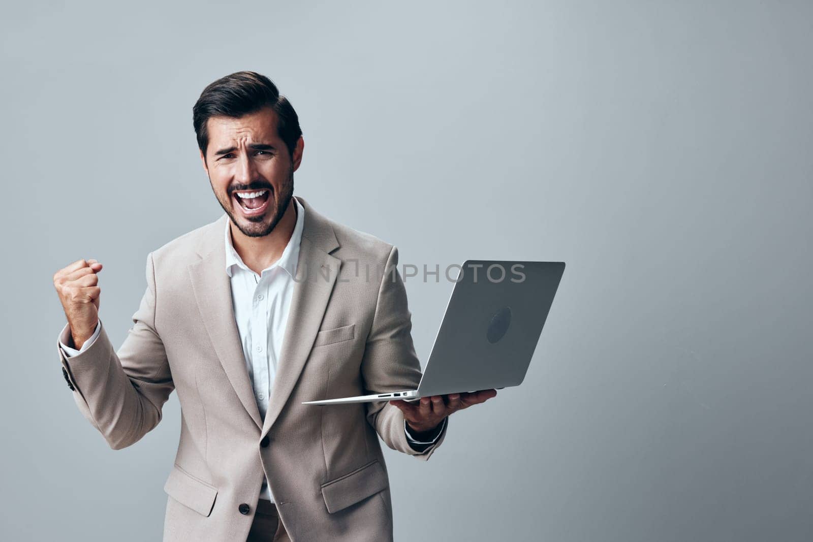 computer man freelancer young isolated entrepreneur job suit laptop smile internet white office shirt copyspace adult business technology corporate studio smiling