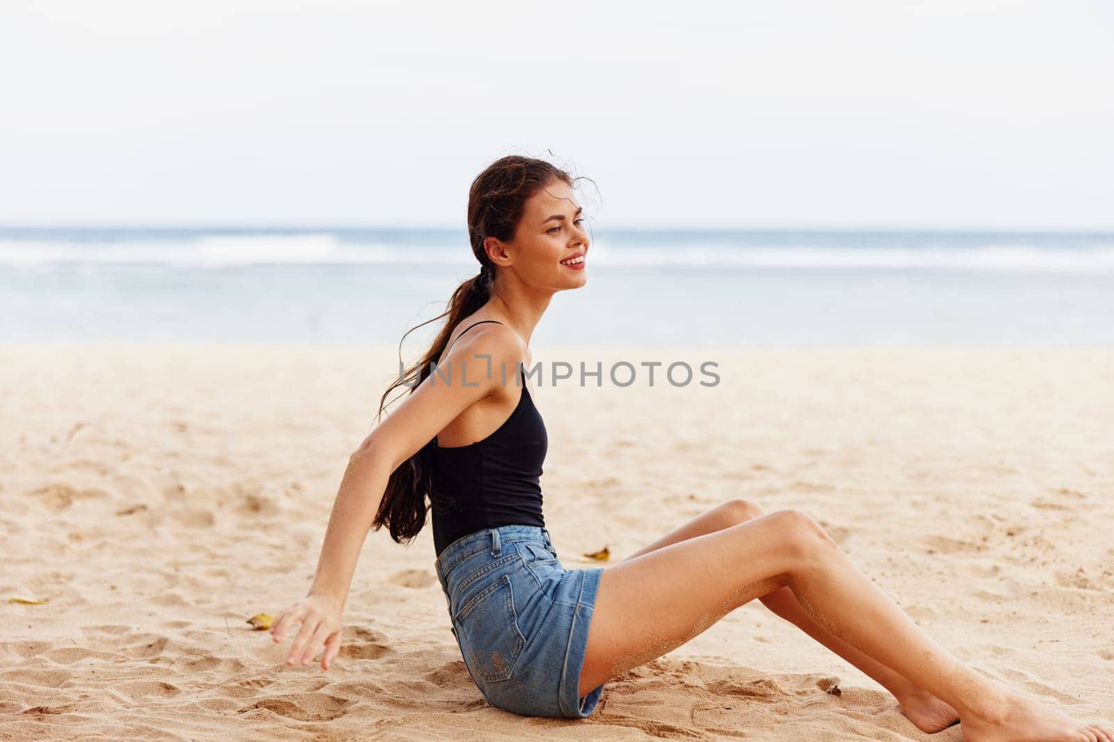 attractive woman vacation sand smile beach sea nature sitting travel freedom by SHOTPRIME