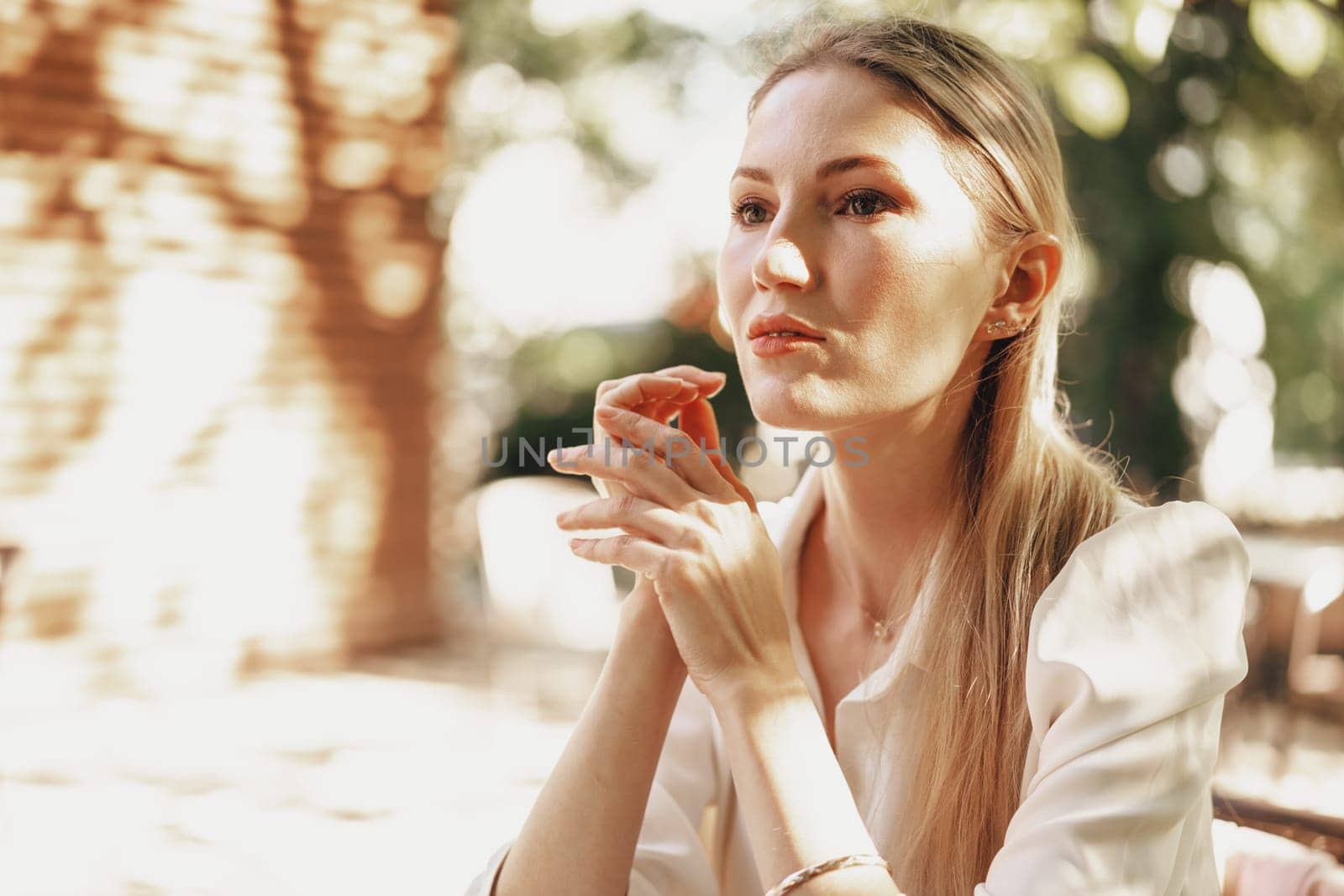 Close up portrait of young blonde businesswoman outdoors