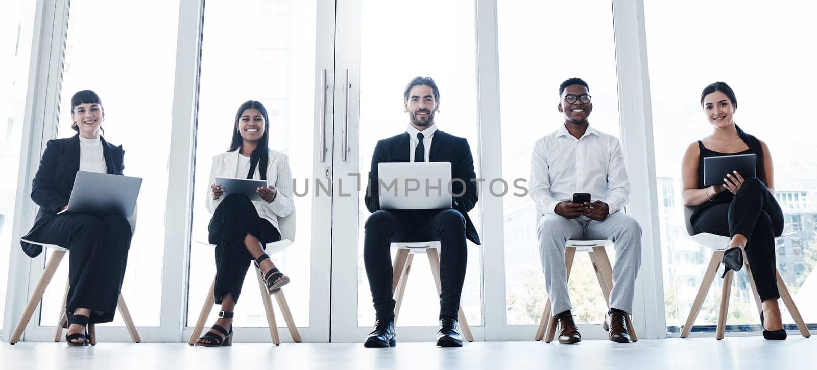 Line, group portrait and people in waiting room with technology and diversity at interview in office. Happy faces, hiring of men and women with business team online for recruitment or human resources.