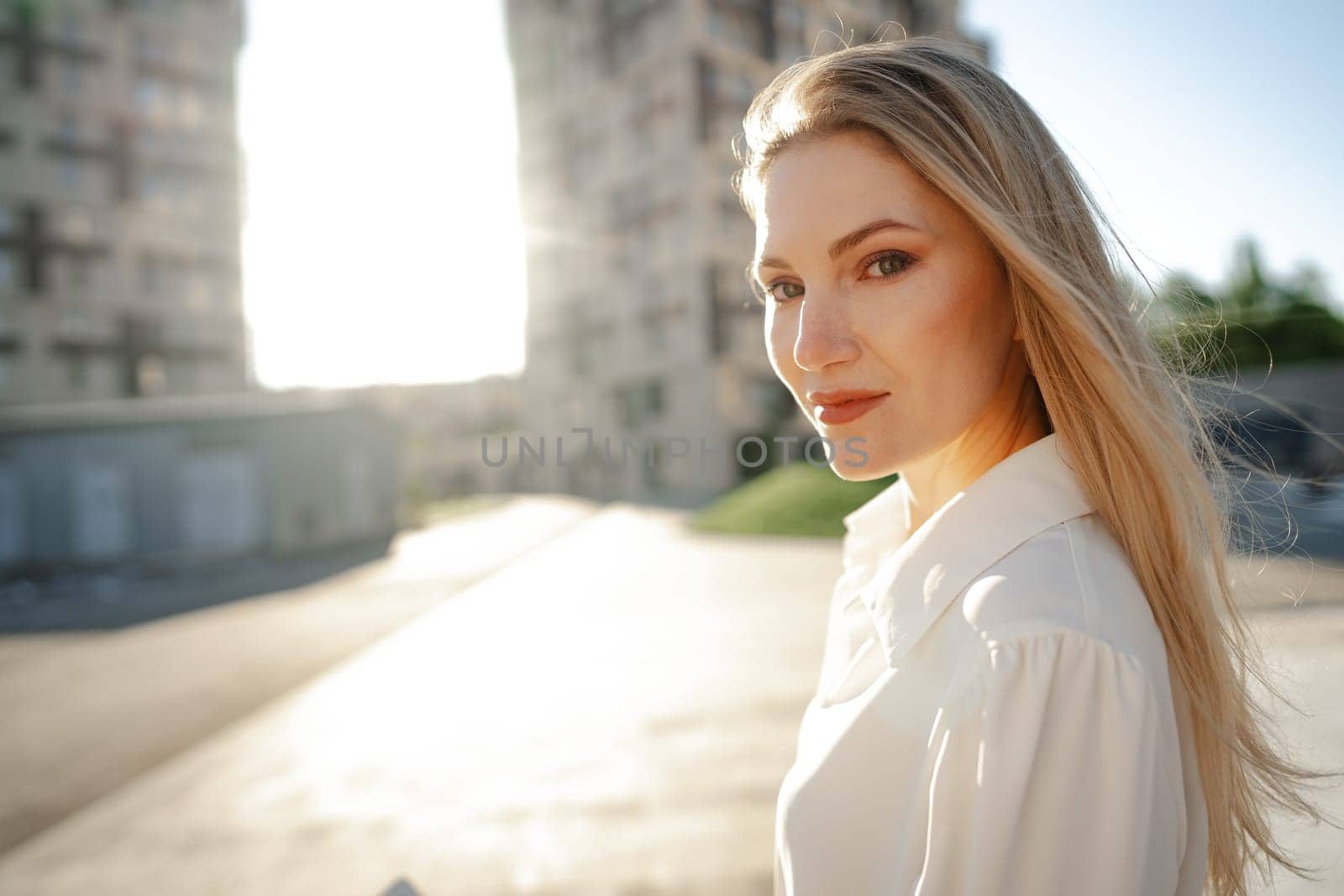 Close up portrait of young blonde businesswoman outdoors