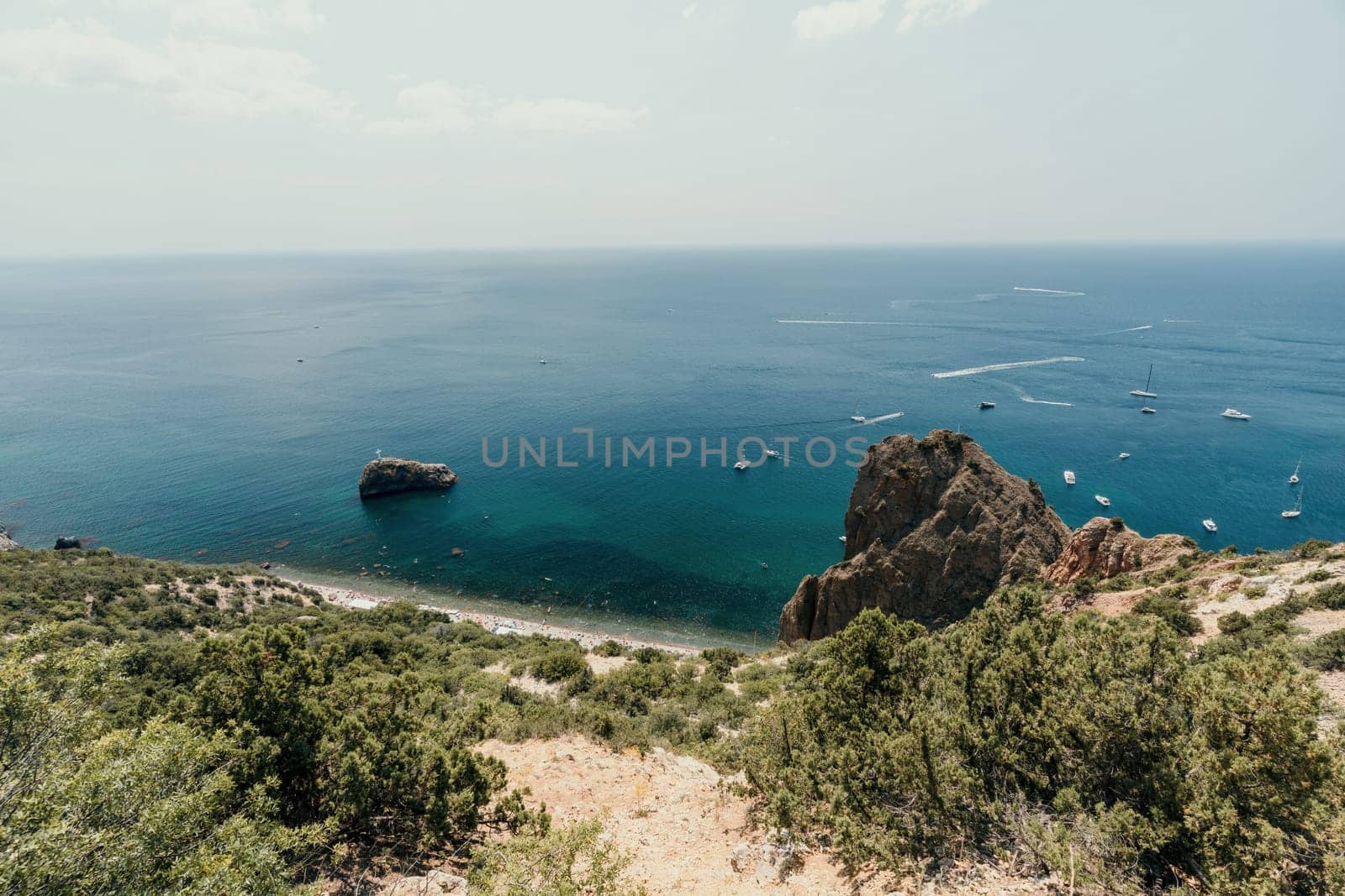 Aerial panoramic view of beautiful sunset above sea. Beautiful seascape. Sun glare, small waves on the water surface. Evening. Horizon. Nobody. No people. Copy space. Never-ending beauty of nature