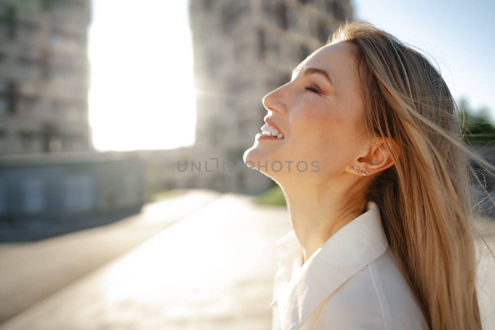 Close up portrait of young blonde businesswoman outdoors