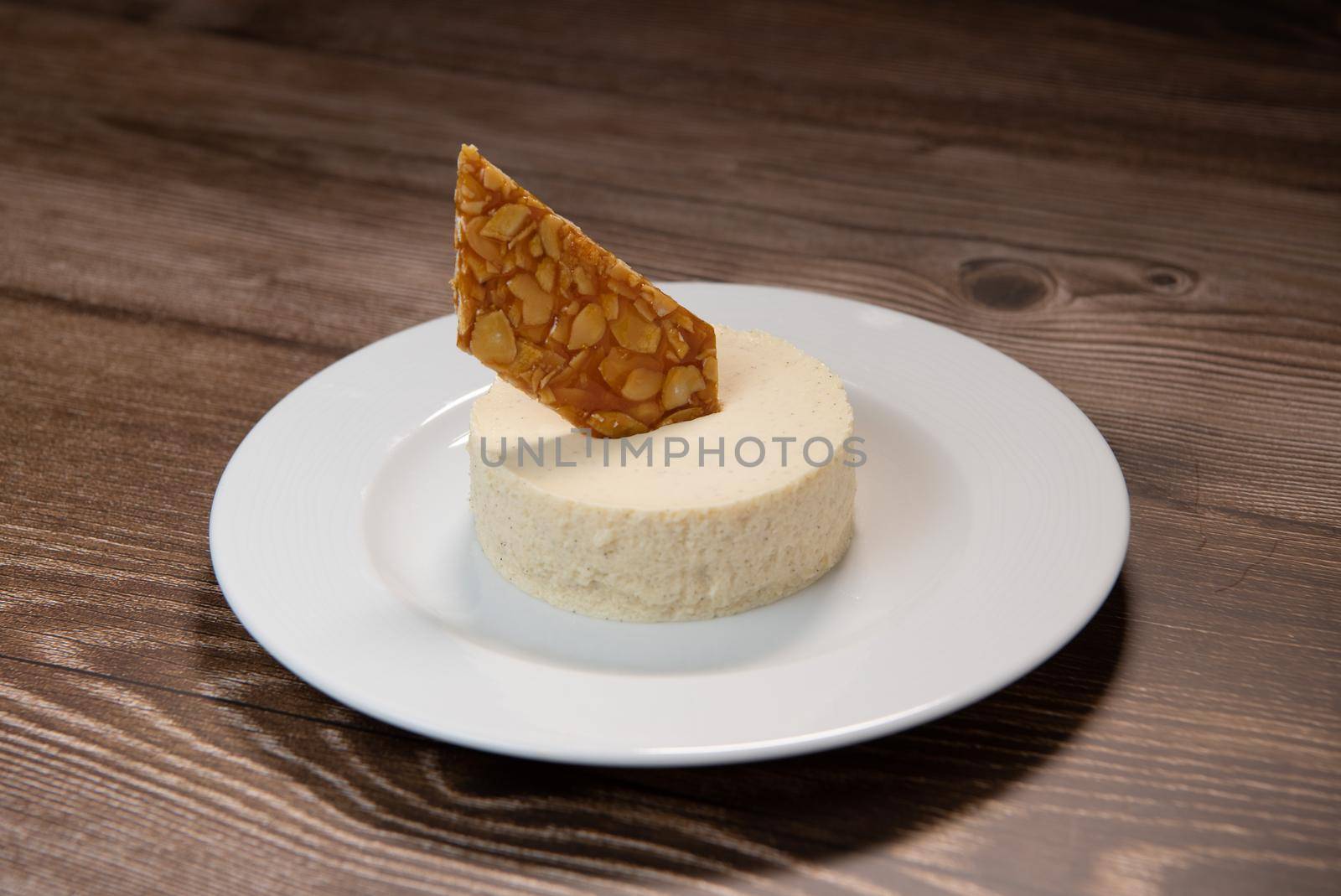 Bavarian recipe with pear and vanilla served with almond nougatine. High quality photo