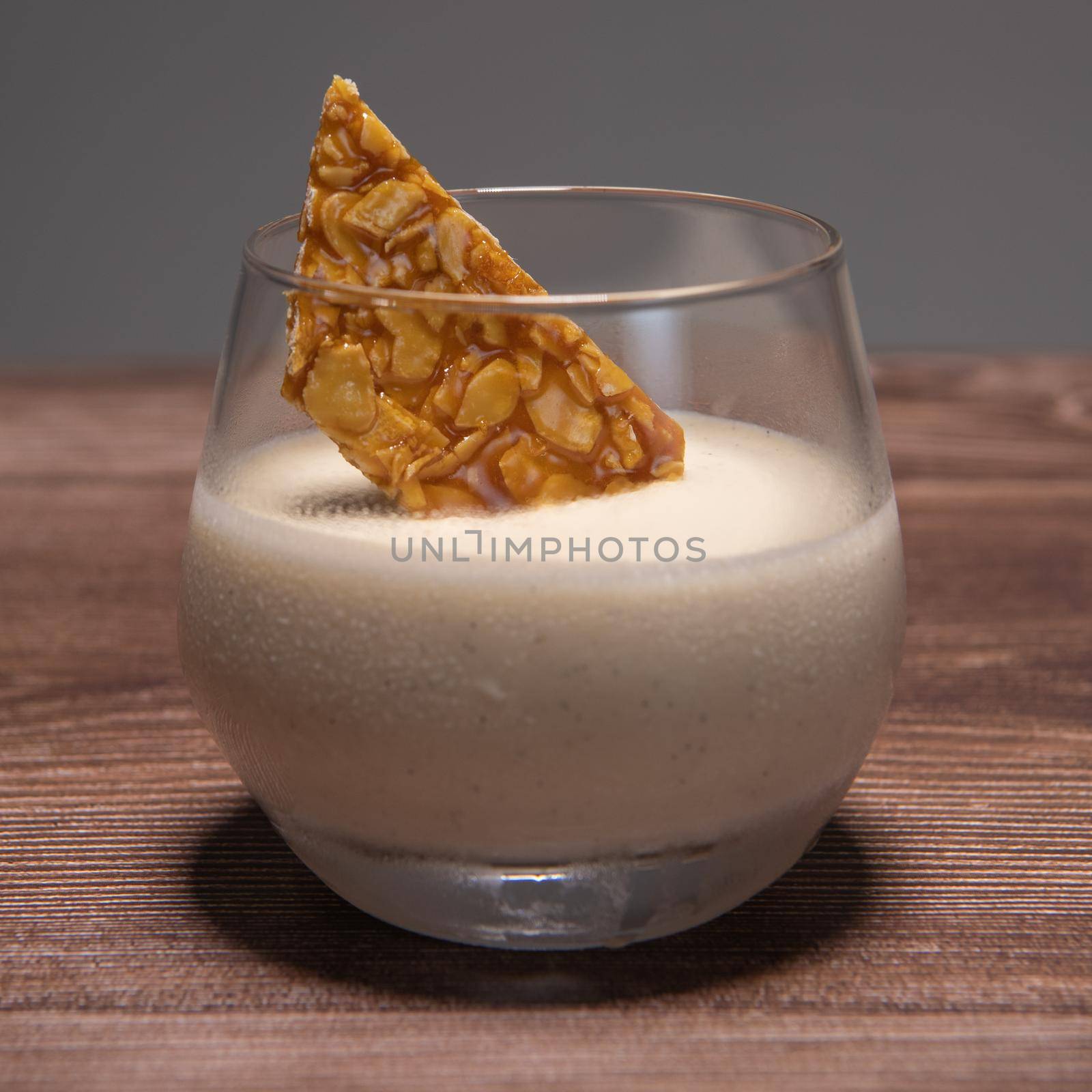 Bavarian recipe with pear and vanilla served with almond nougatine. High quality photo