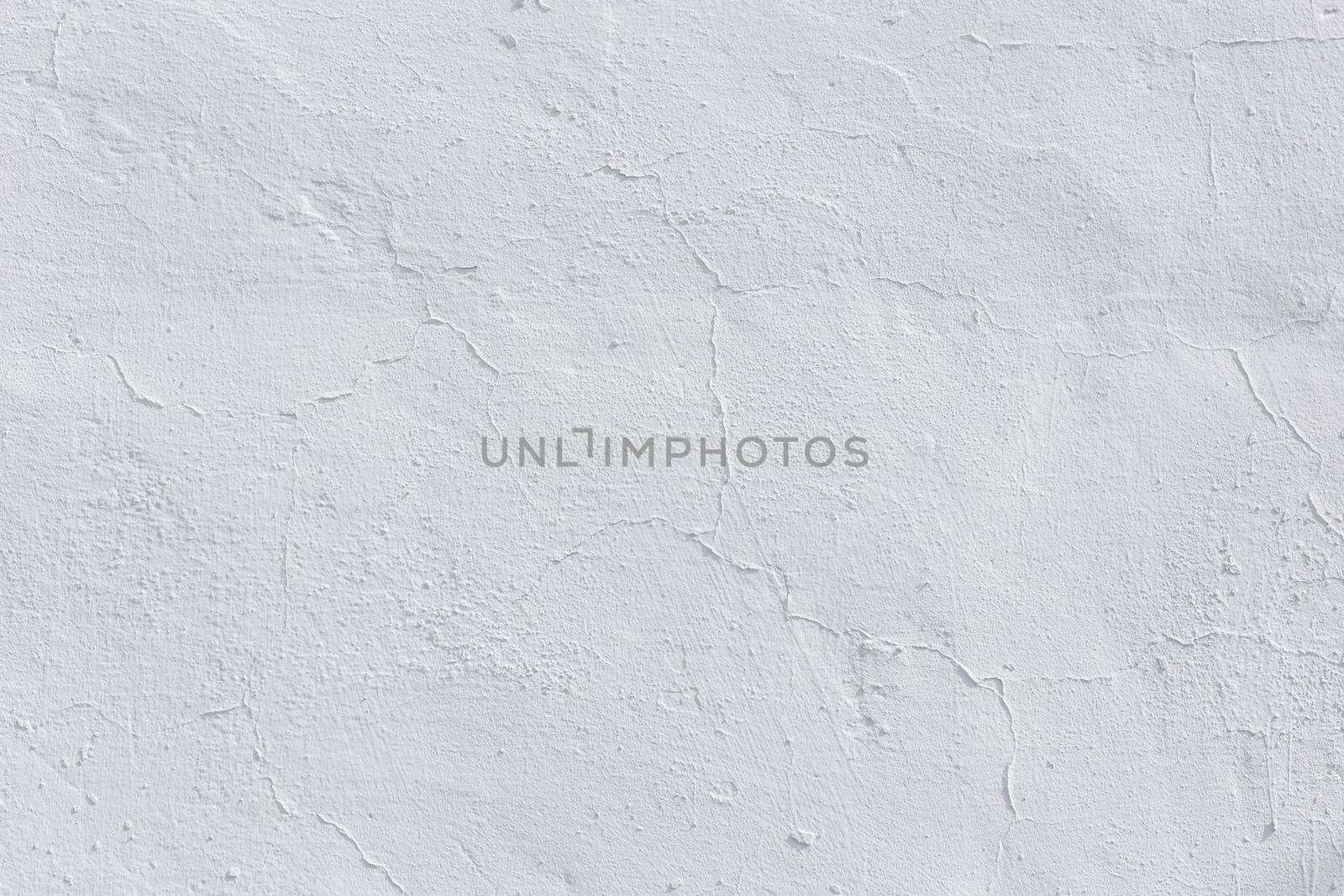 shabby dry white plaster under direct sunlight texture and full frame background